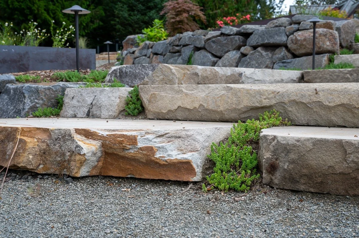 Stone staircase with a gravel landing.