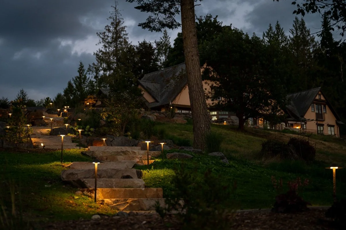 Stone staircase lit up with LED pathway lights.