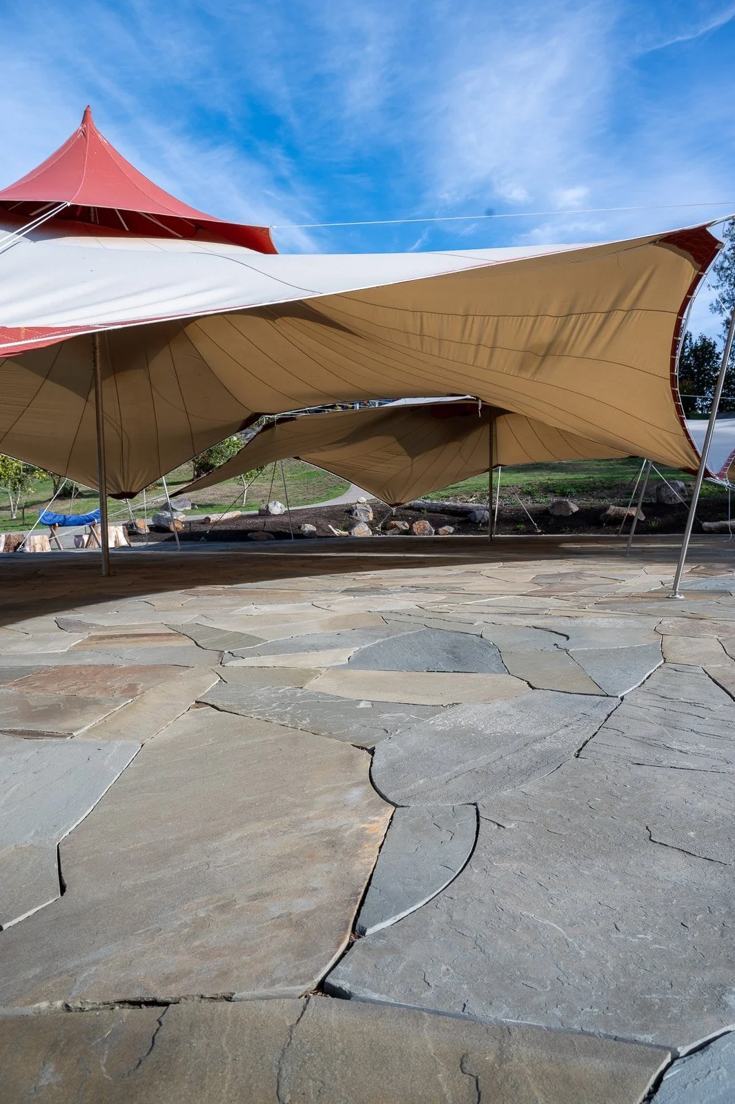 Double tan and red wedding tents over natural slate patio-143.jpg