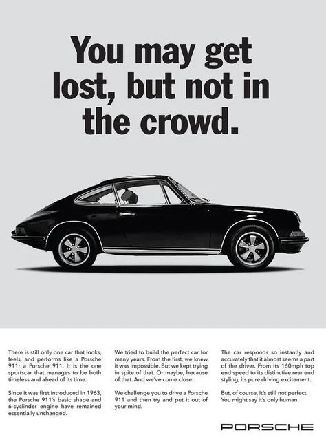 Vintage Porsche 911 advertisement with side profile of car and slogan "You may get lost, but not in the crowd."