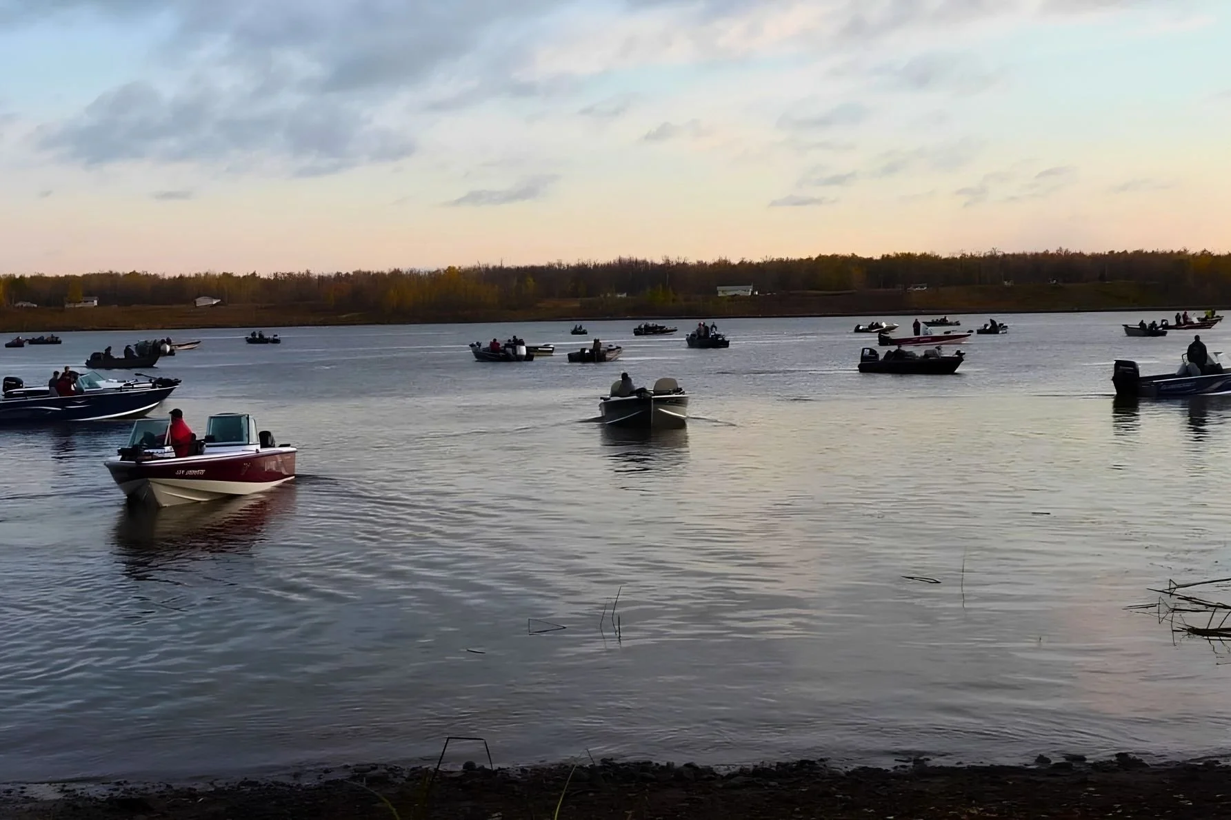 Boats on the Winnipeg River in Powerview-Pine Falls, Manitoba, highlighting the amazing fishing opportunities in Powerview-Pine Falls, also known as the Walleye Capital of Manitoba.