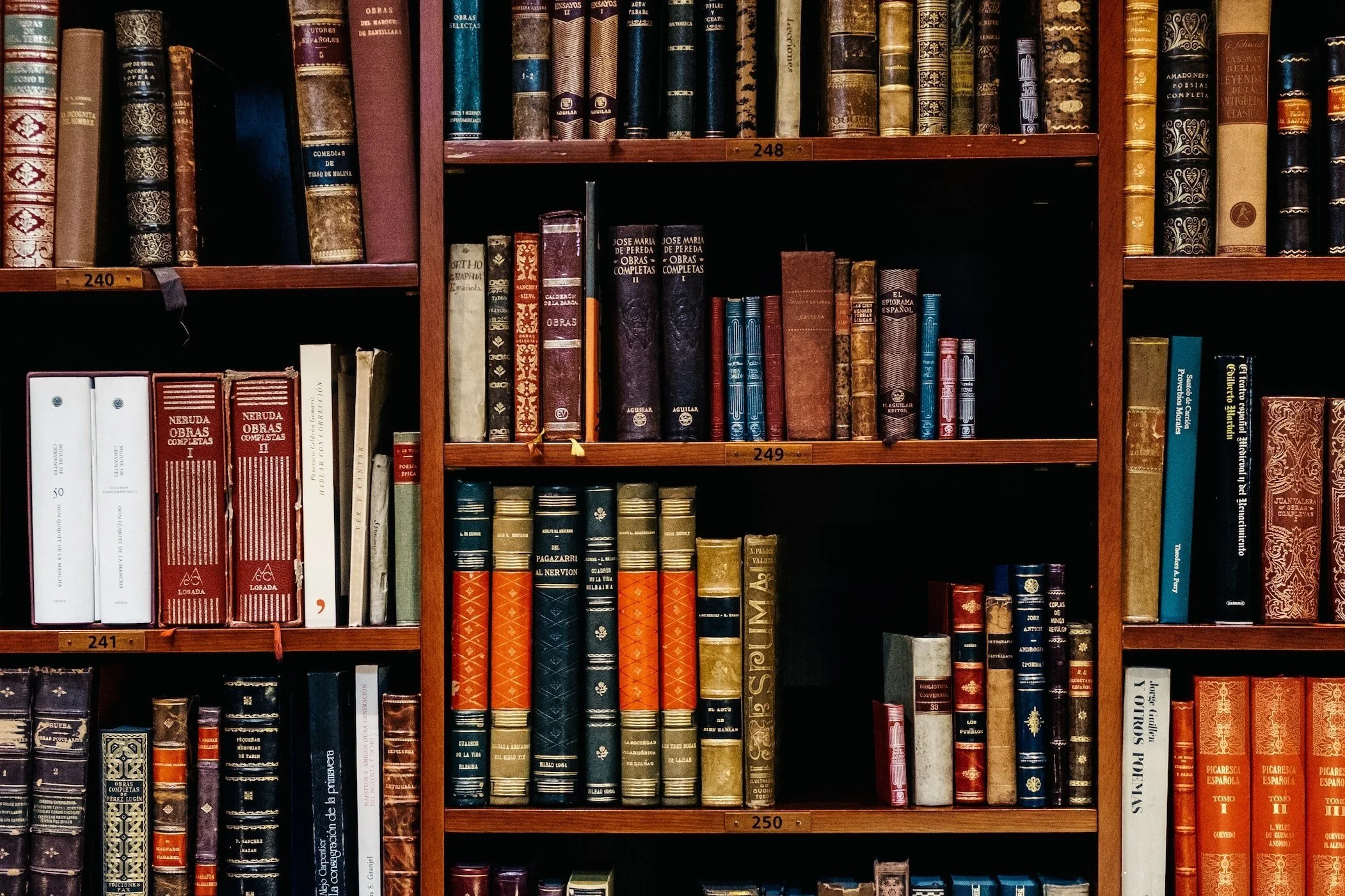 Bookshelf filled with assorted vintage books