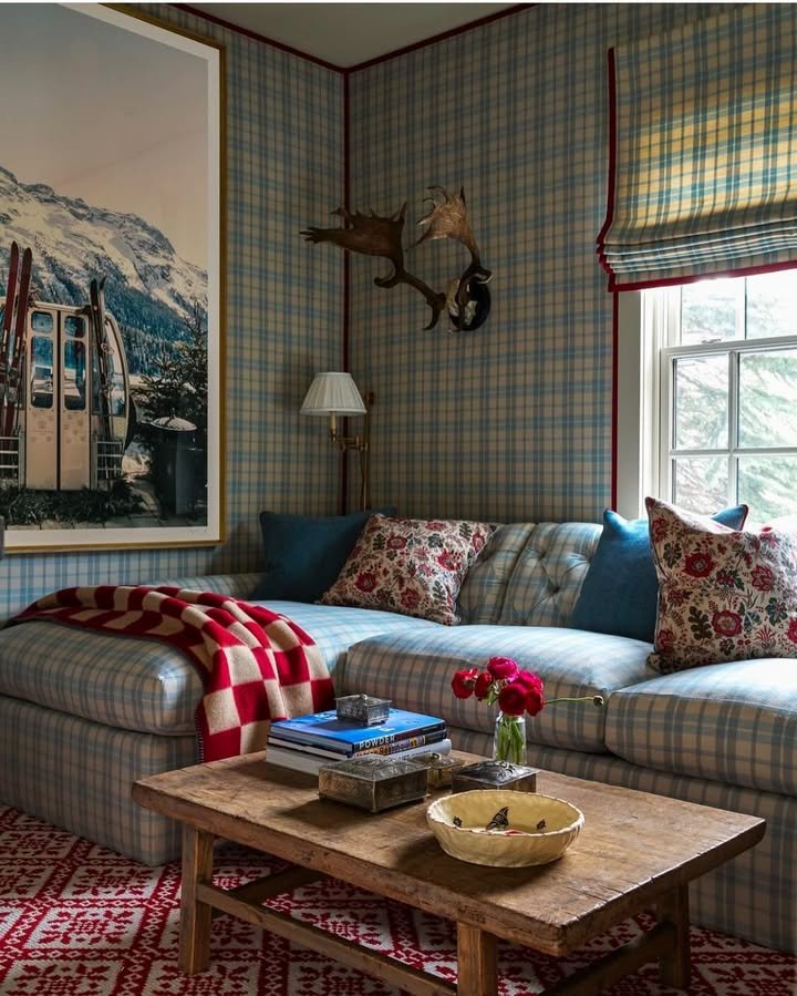 Living room featuring layered plaid patterns across upholstery and textiles, designed by Avrea & Company and photographed by Nathan Schroder Photography.