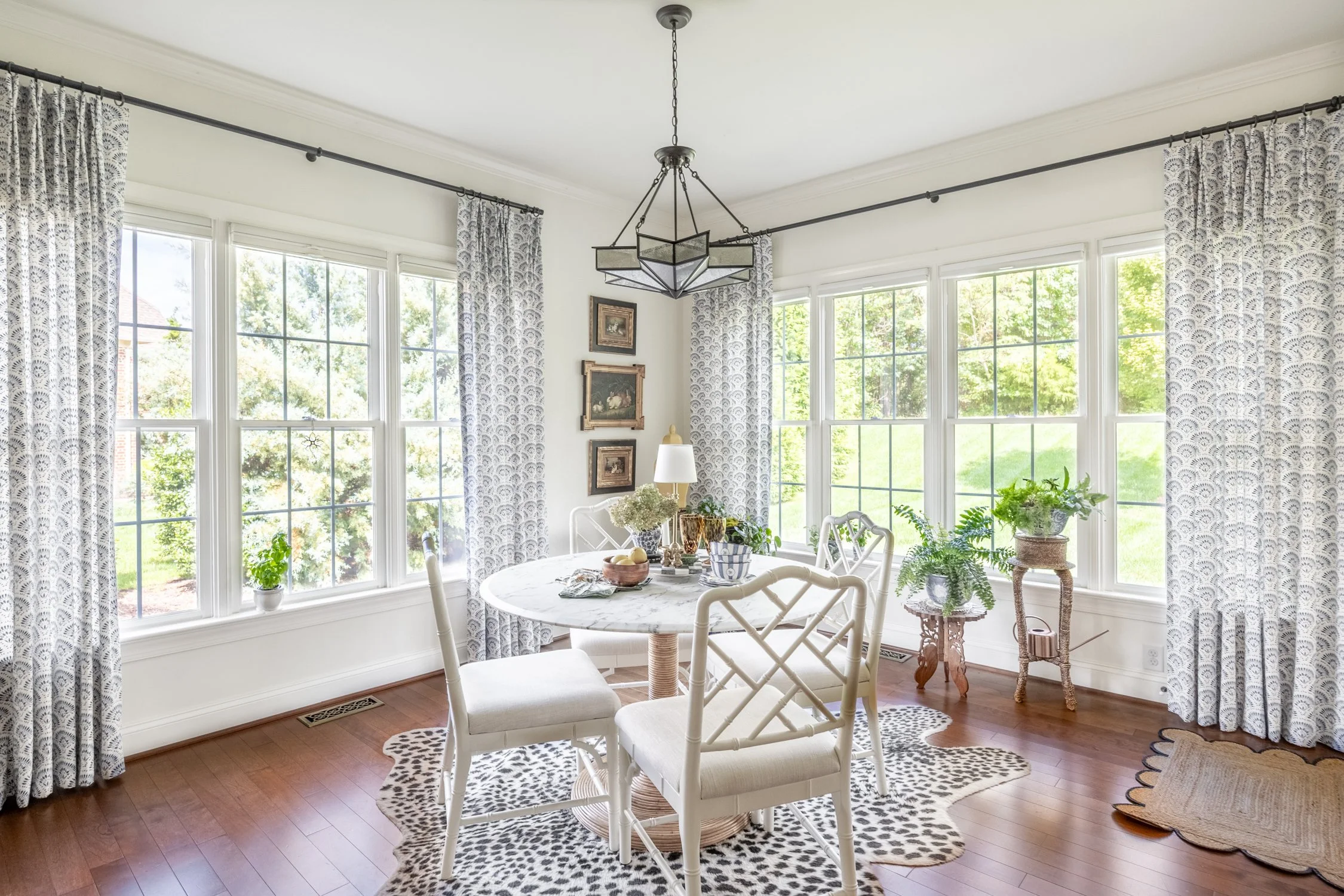 Full view of a light-filled kitchen featuring custom drapery and a warm, livable design.