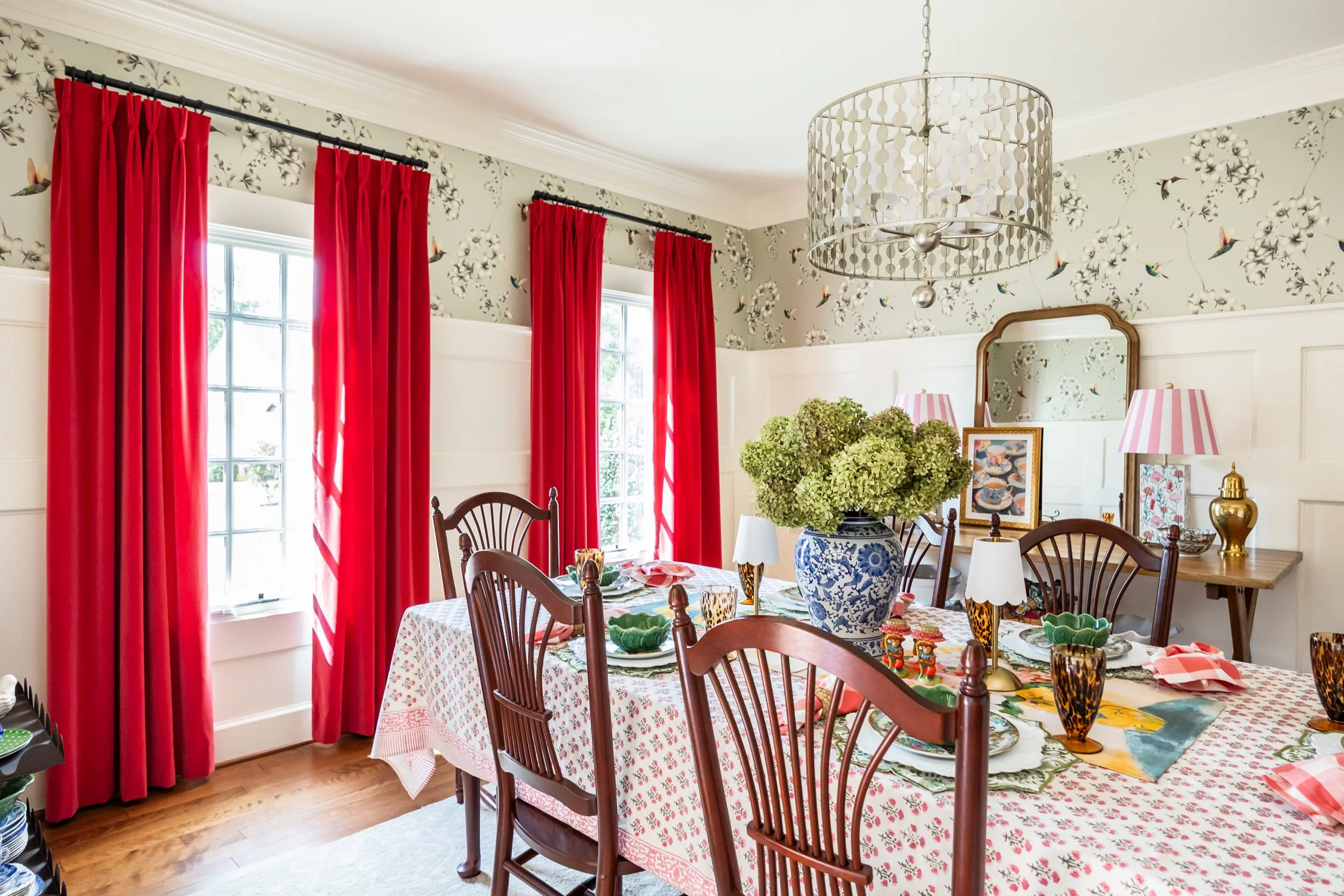 Dining room featuring cotton velvet drapes and layered accessories for a warm, elegant look.