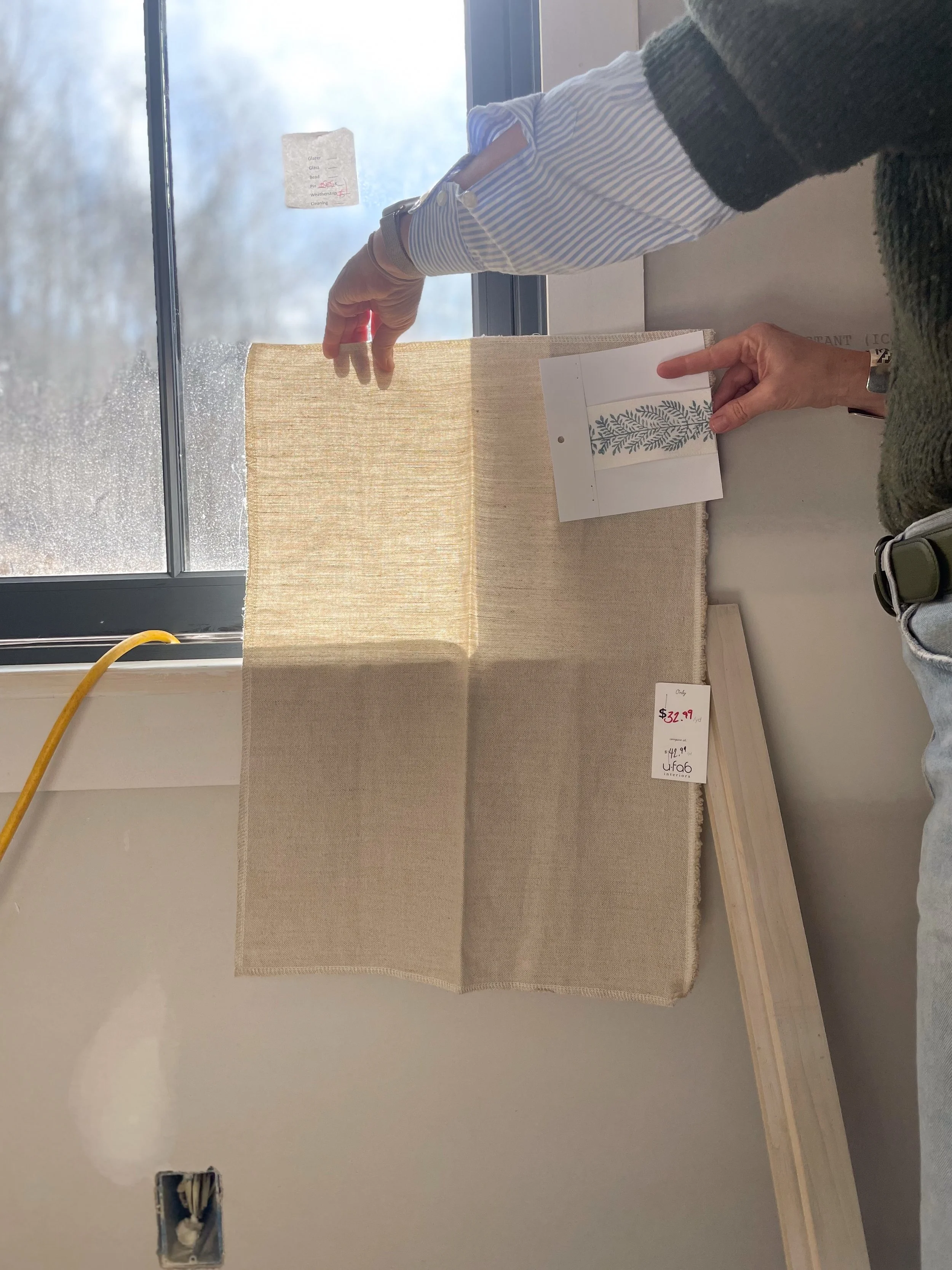 Your vision, our expertise. From fabric and trim samples to finished projects, we love turning your ideas into reality, one detail at a time!

This custom Roman shade&rsquo;s textured fabric catches the light beautifully, filtering it softly into the