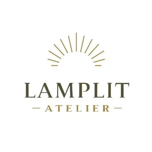 Logo for Lamplit Atelier with a rising sun design above the text.