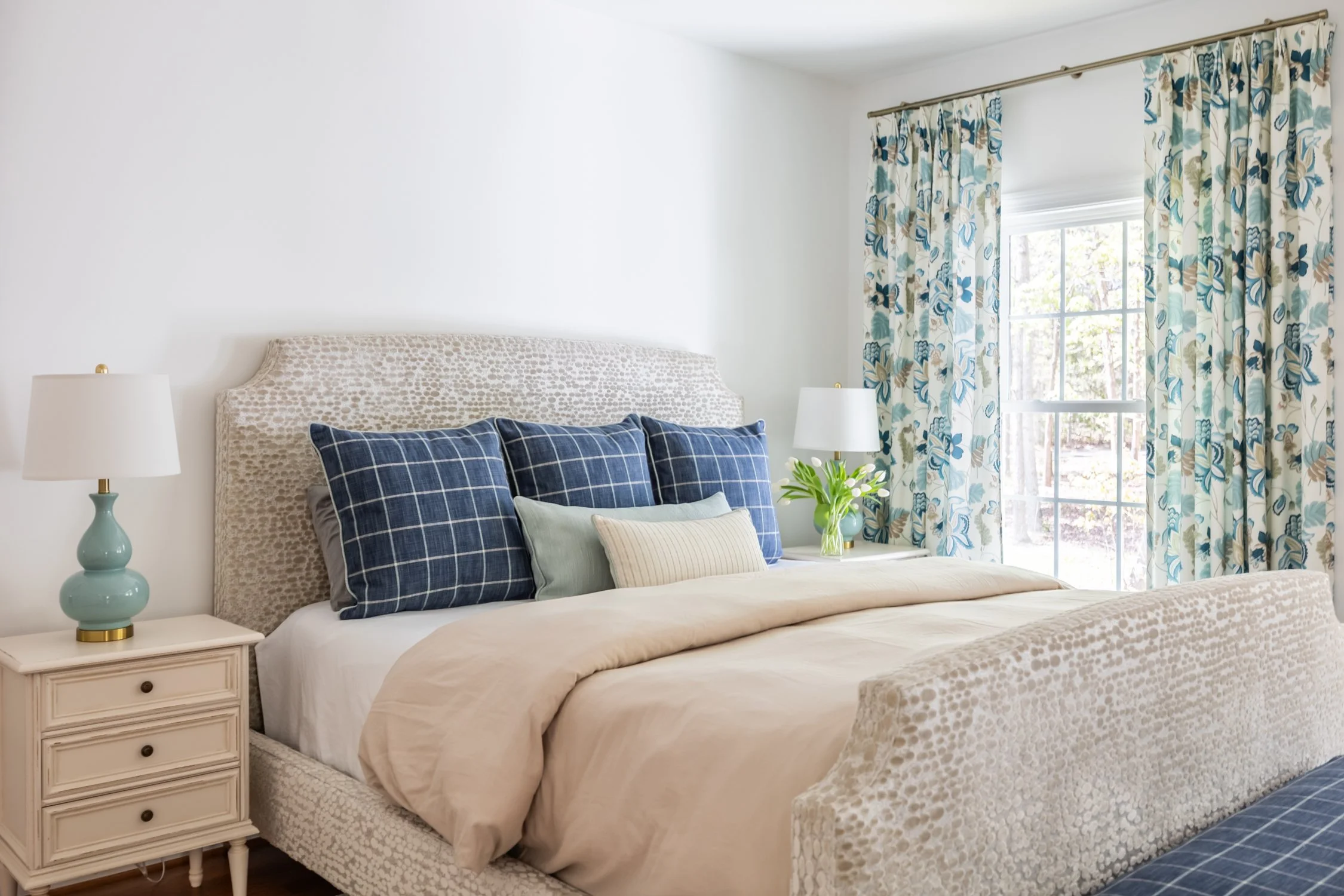 Lee Industries upholstered bed designed with custom pillows, window treatments and bedding.