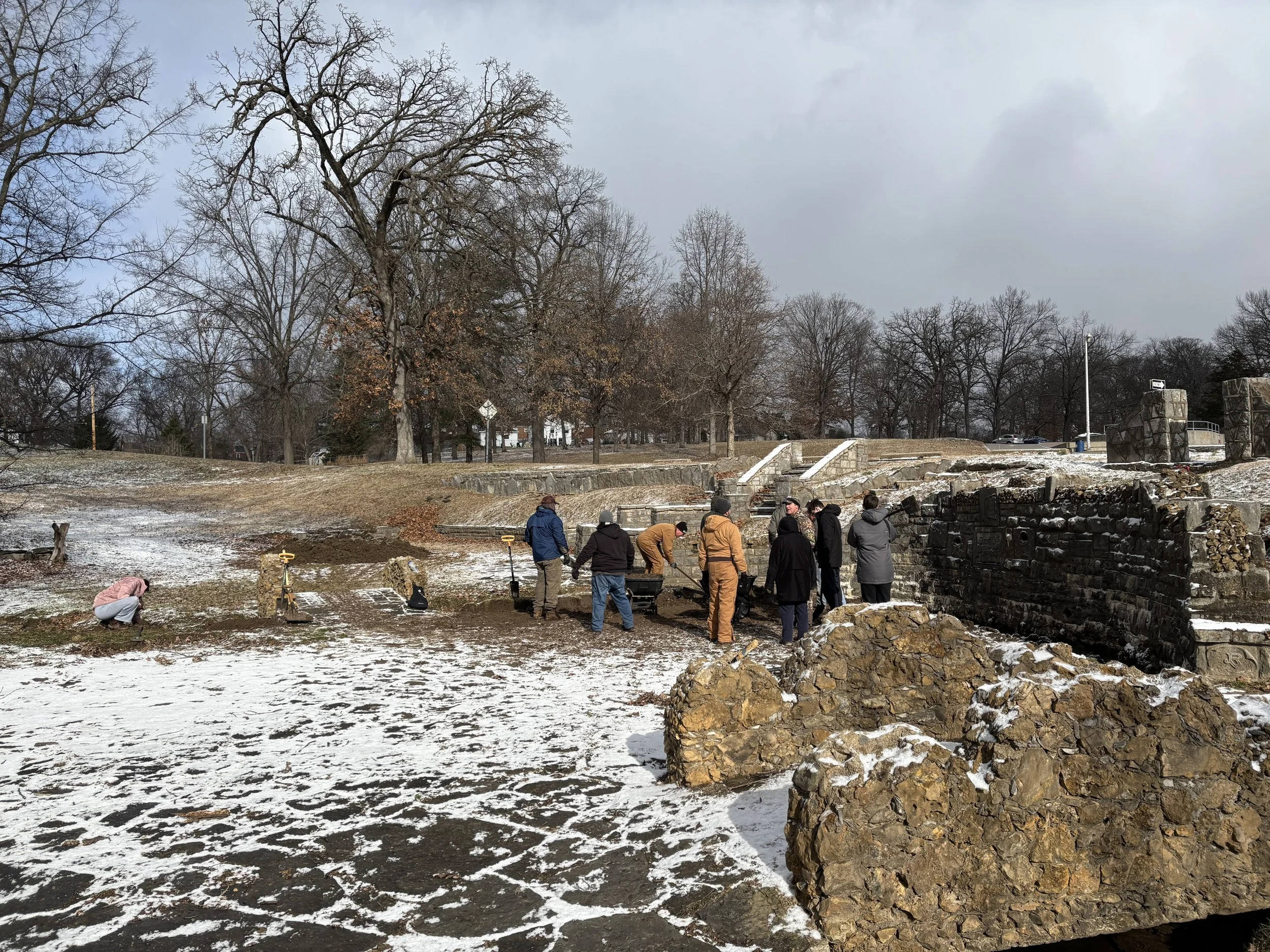 Volunteers shoveling soil at the work site - photo by Erin Nichols