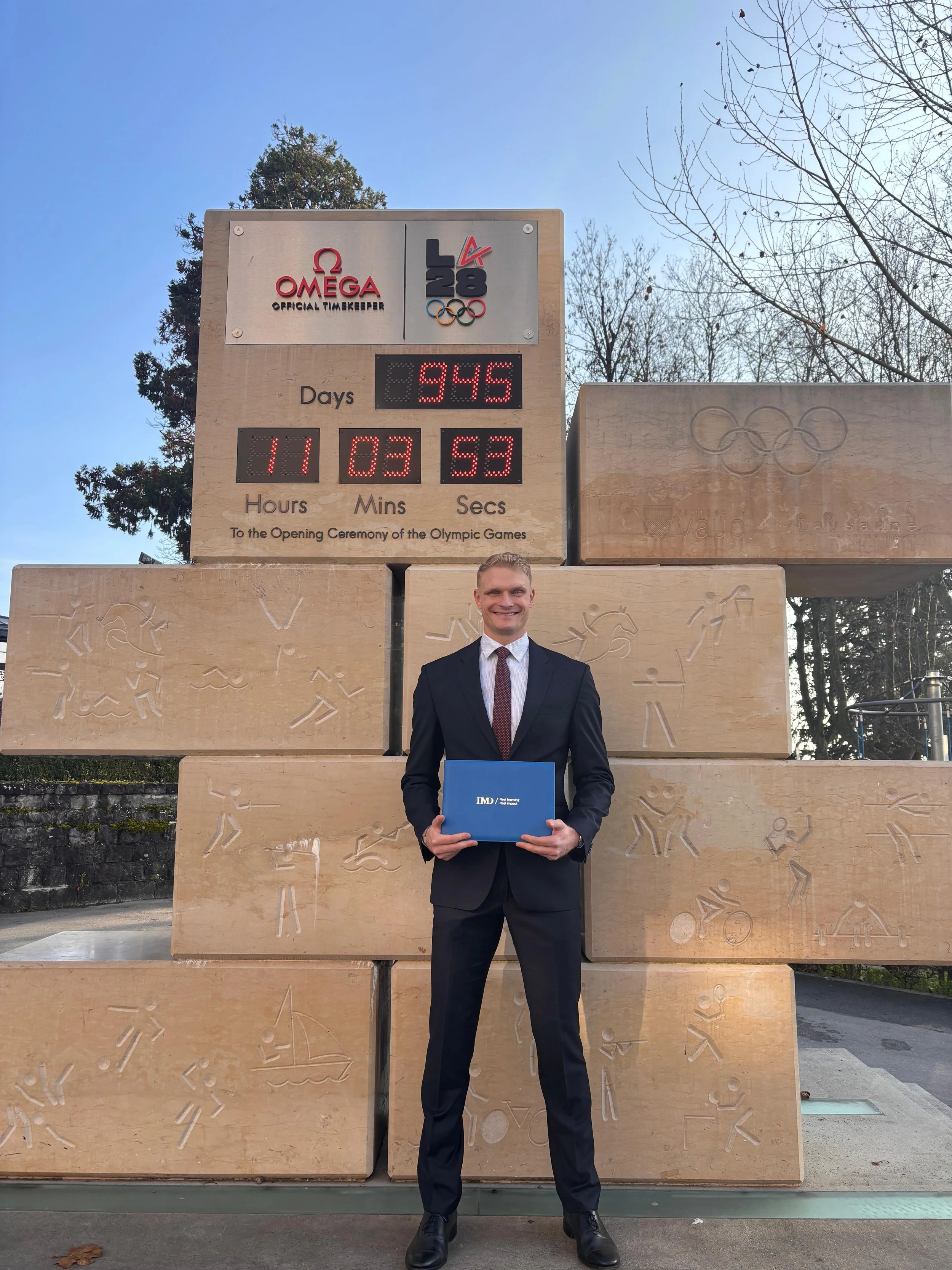 Oliver Zeidler at IMD Lausanne MBA graduation ceremony with Honors. Countdown LA2028 Olympics