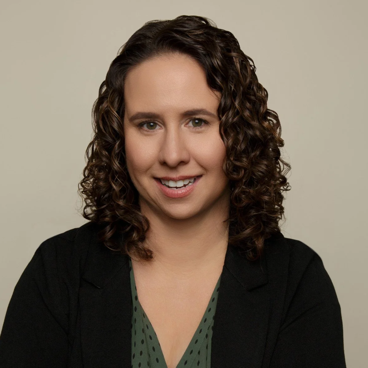 Casual headshot on neutral background