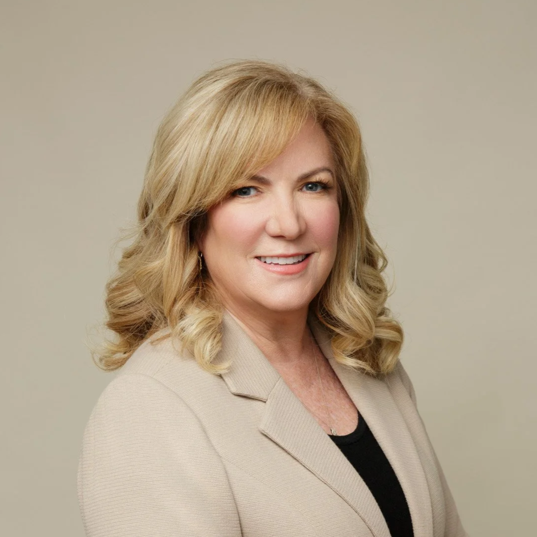 Headshot of PhD graduate smiling after successful dissertation defense