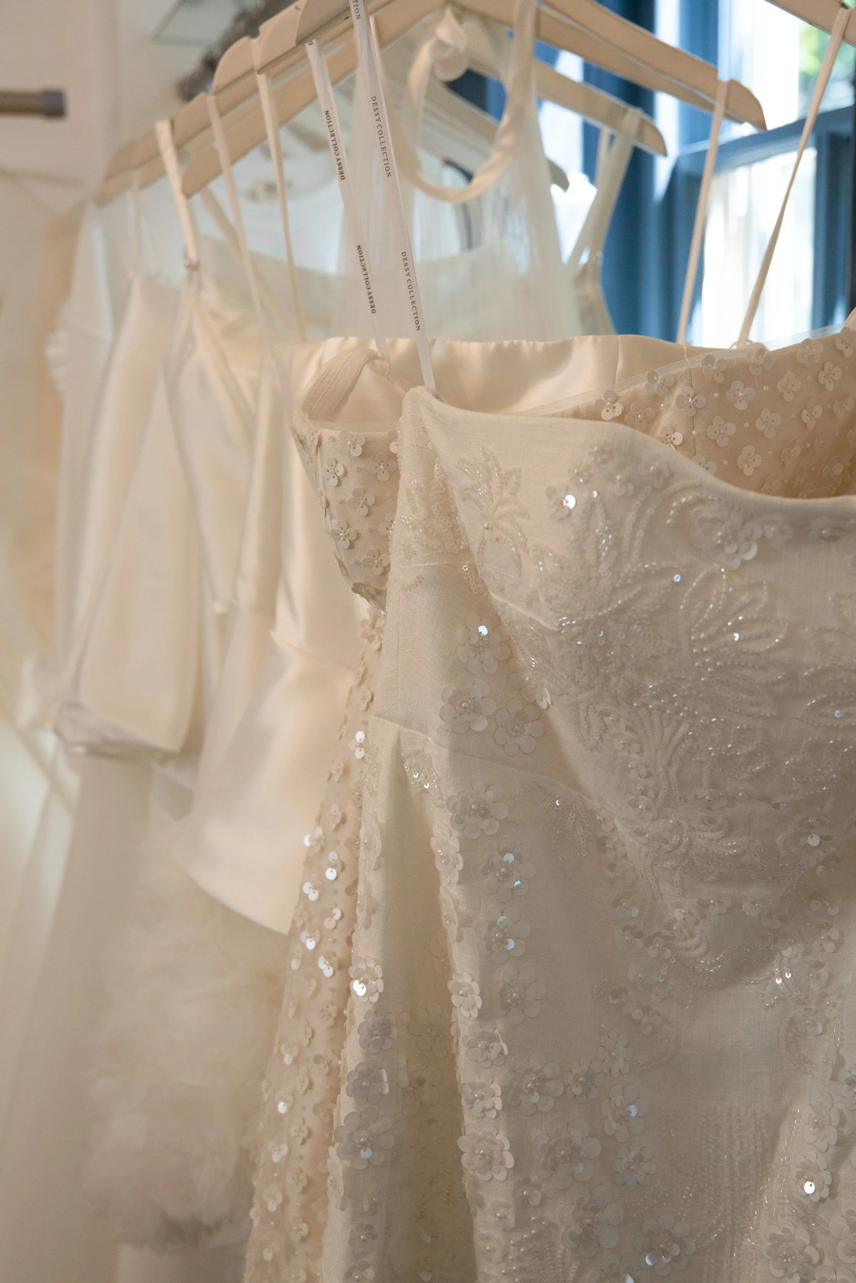 Beaded white wedding gown displayed at Page Six bridal boutique in Skippack, Pennsylvania.
