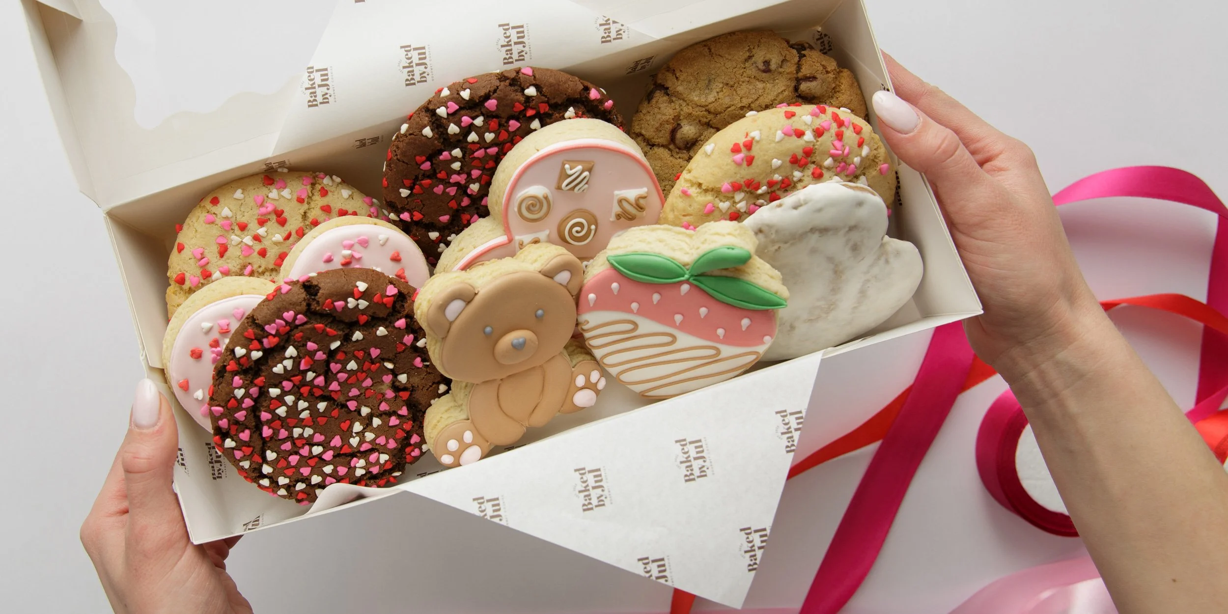 Valentine’s Day product photography showing cookies styled as a wide banner image for small business website headers and marketing use.