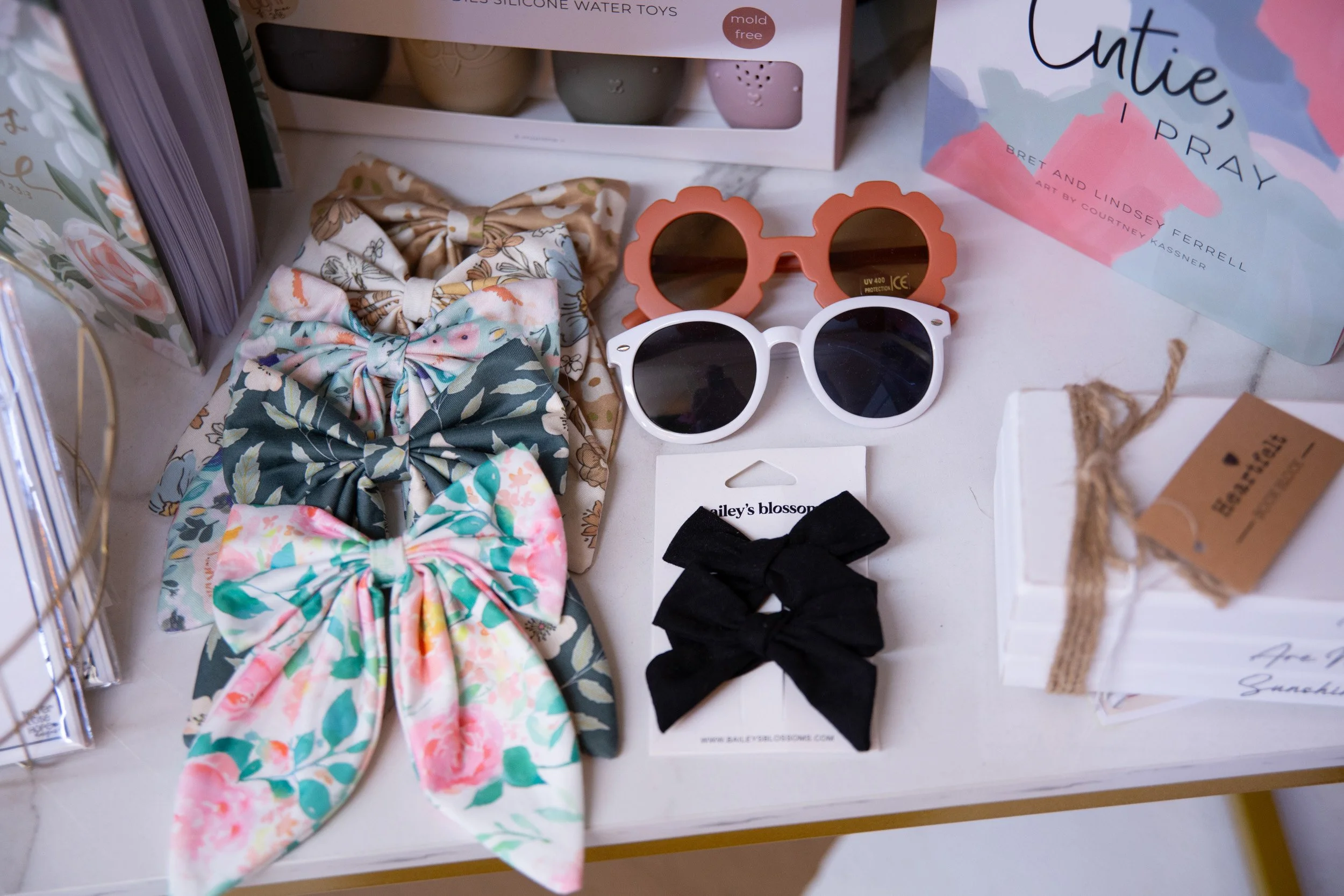 Floral hair bows and children's sunglasses displayed at Little Light of Mine in Skippack, Pennsylvania.