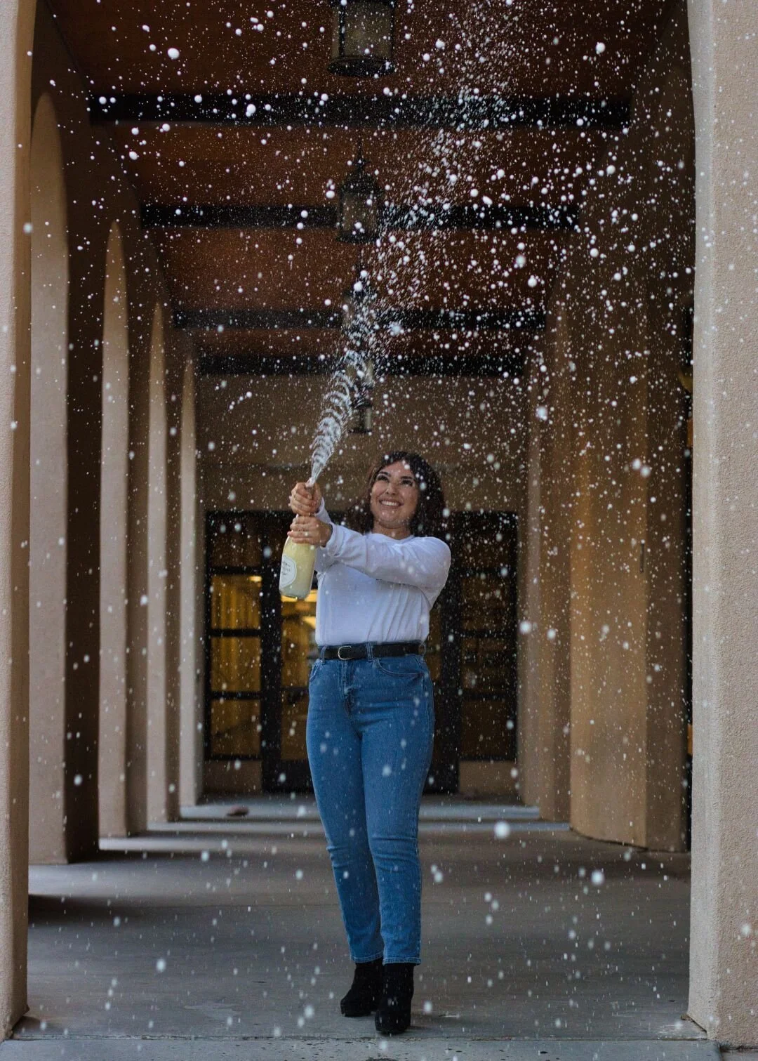 College graduation portrait photography with champagne at New Mexico State University