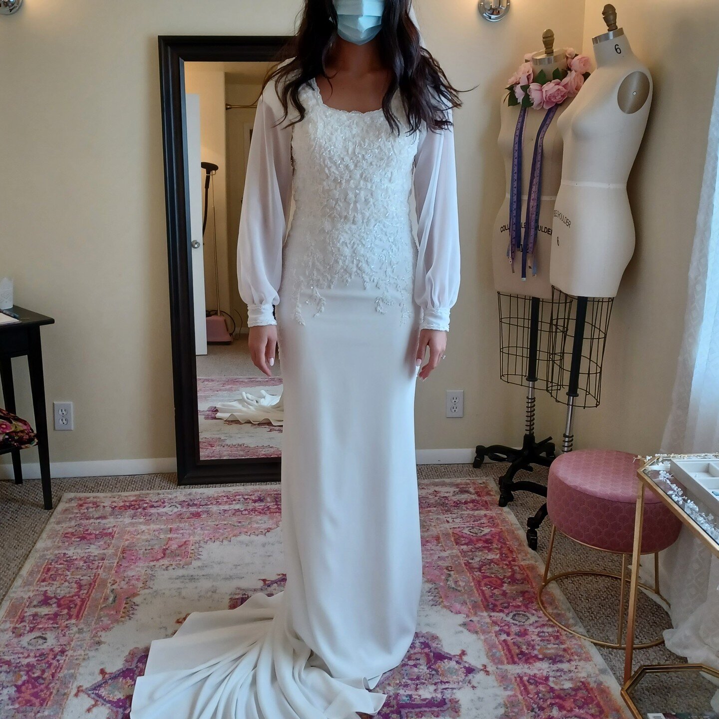 Modest Redesign: This lovely beaded and fitted crepe gown was originally an illusion bodice with deep v on front and back. The bride had a clear vision of what she wanted, including these pretty little bishop sleeves. The design required a complete d
