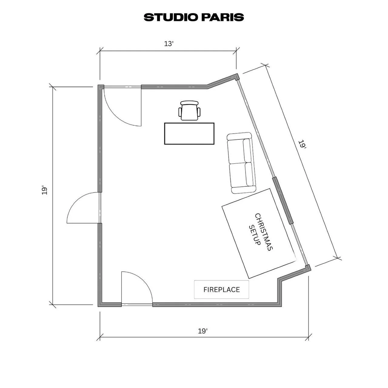 Floor plan of a studio room labeled 'Studio Paris', measuring 19 feet by 19 feet, with entrances on two sides, a fireplace on one wall, a sofa and a Christmas setup on another wall, a desk with a chair near the top wall.