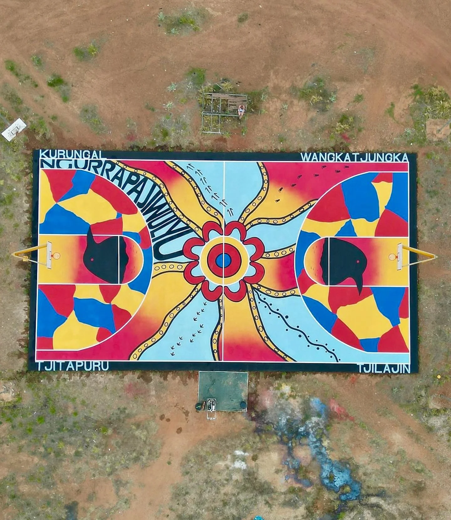 So lucky I get to work on projects like this with House of Darwin! Hoop Dreams basketball court no.5! 🏀 @acidwashbible and I set off coast to coast, Darwin to Broome then drove five hours inland through the western desert to the vibrant Wangkatjungk