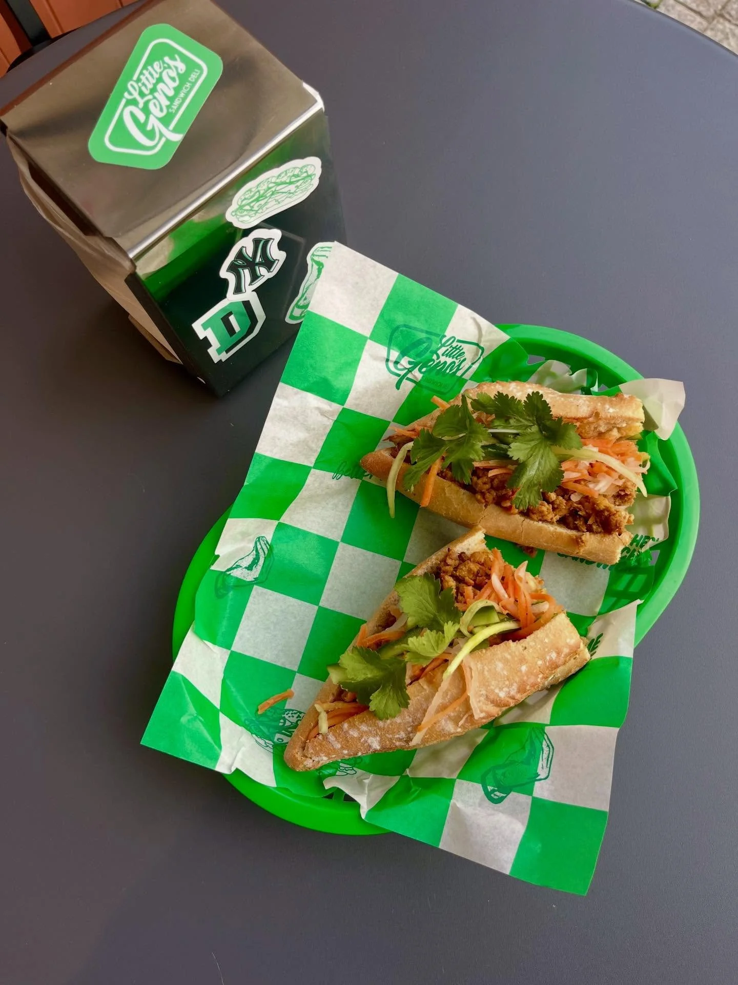 The CHICKEN B&Aacute;NH M&Igrave;

Crusty French Baguette 
Vietnamese Lemongrass Ground Chicken 
Shredded Carrot, Daikon Radish + Cucumber
Black Garlic Aioli
Jalape&ntilde;o Vinaigrette 
Coriander