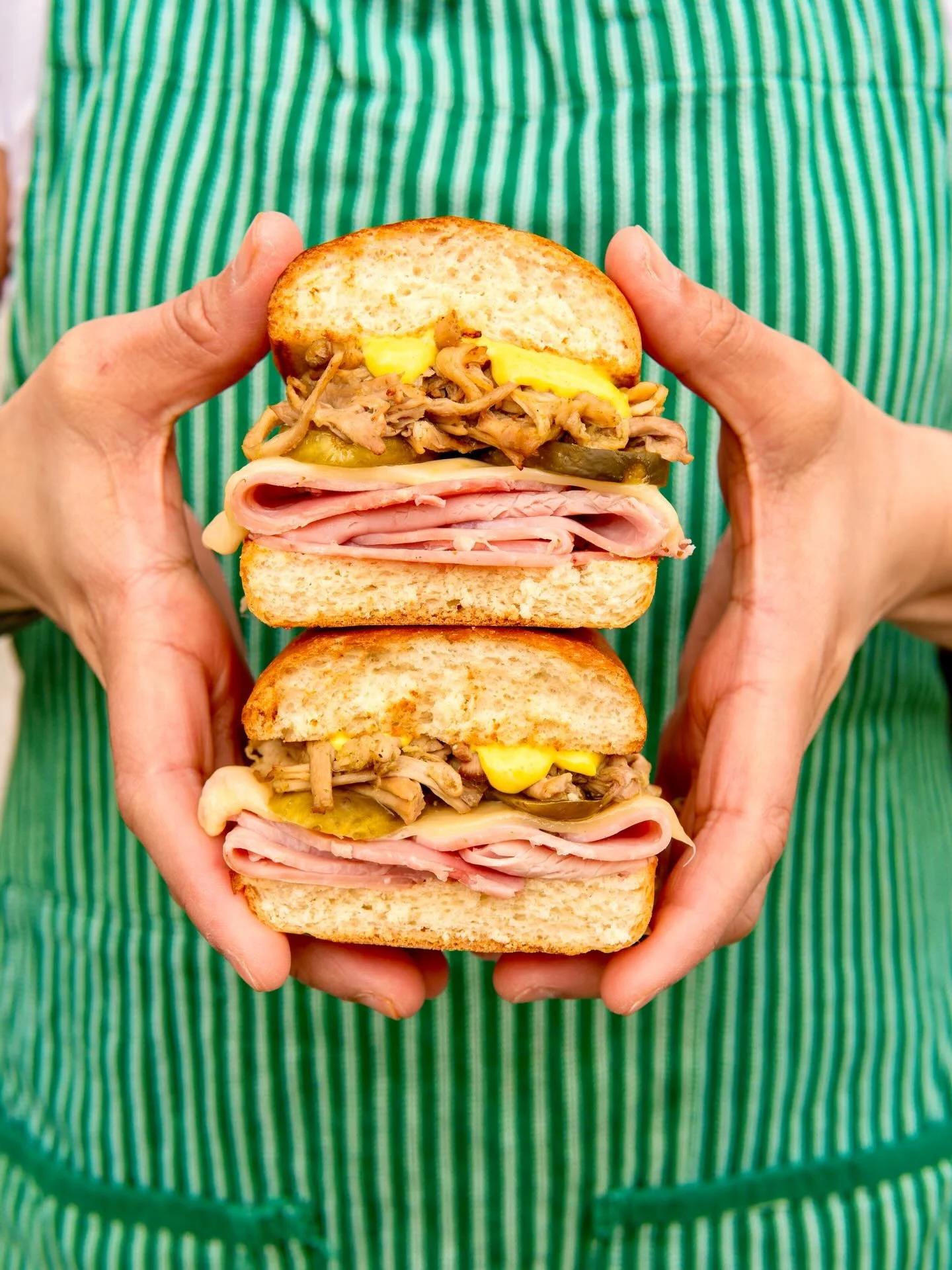 CUBANO

Grilled Cuban Bread
Roast Mojo Pork Shoulder
Smoked Ham
Pickles
Mustard Aioli