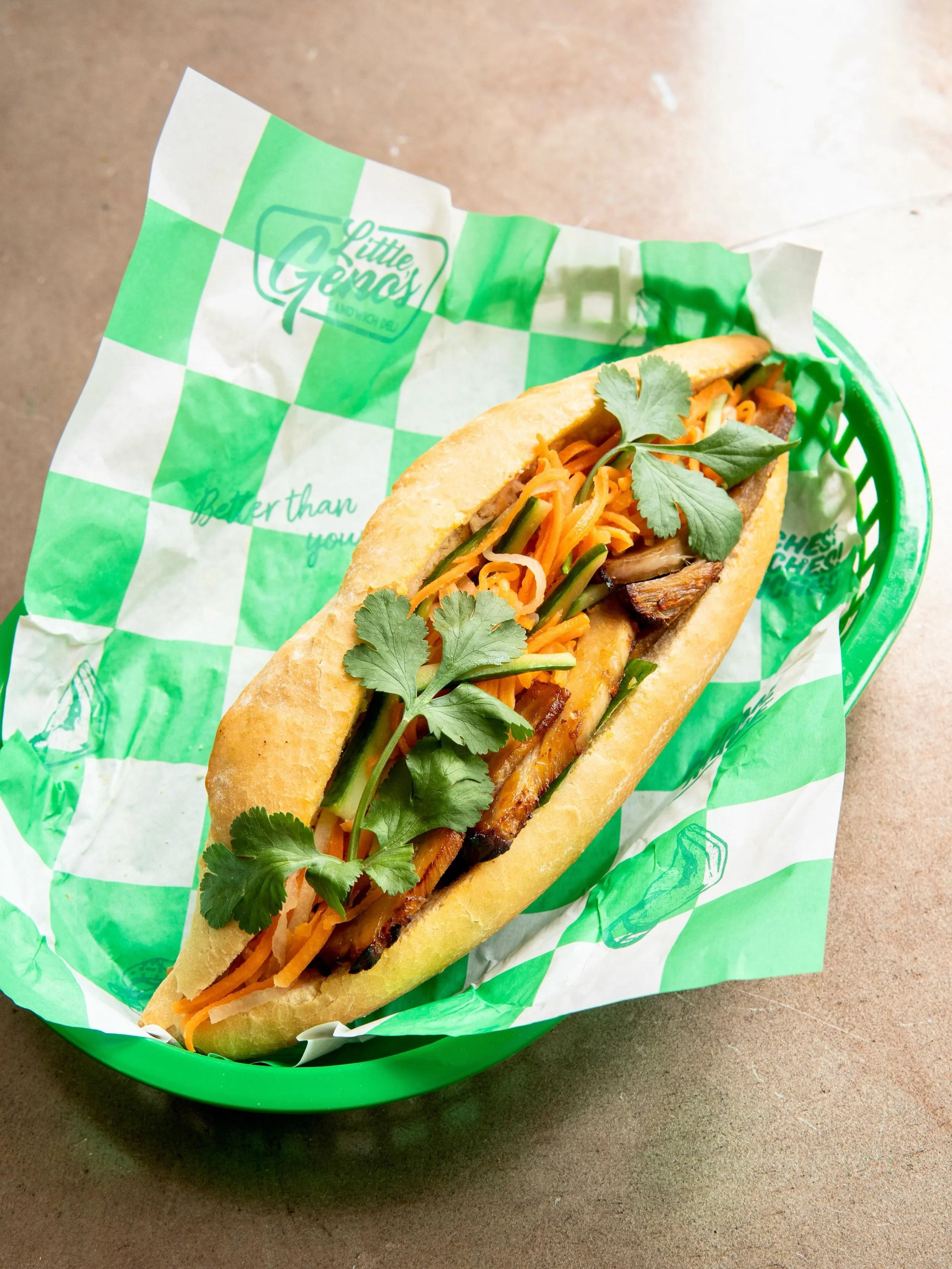 B&Aacute;NH M&Igrave;
Crusty French Baguette 
Vietnamese Spiced Pork Sausage
Sticky Lemongrass Pork Belly
Shredded Carrot, Daikon Radish + Cucumber
Black Garlic Aioli
Jalape&ntilde;o Vinaigrette 
Coriander