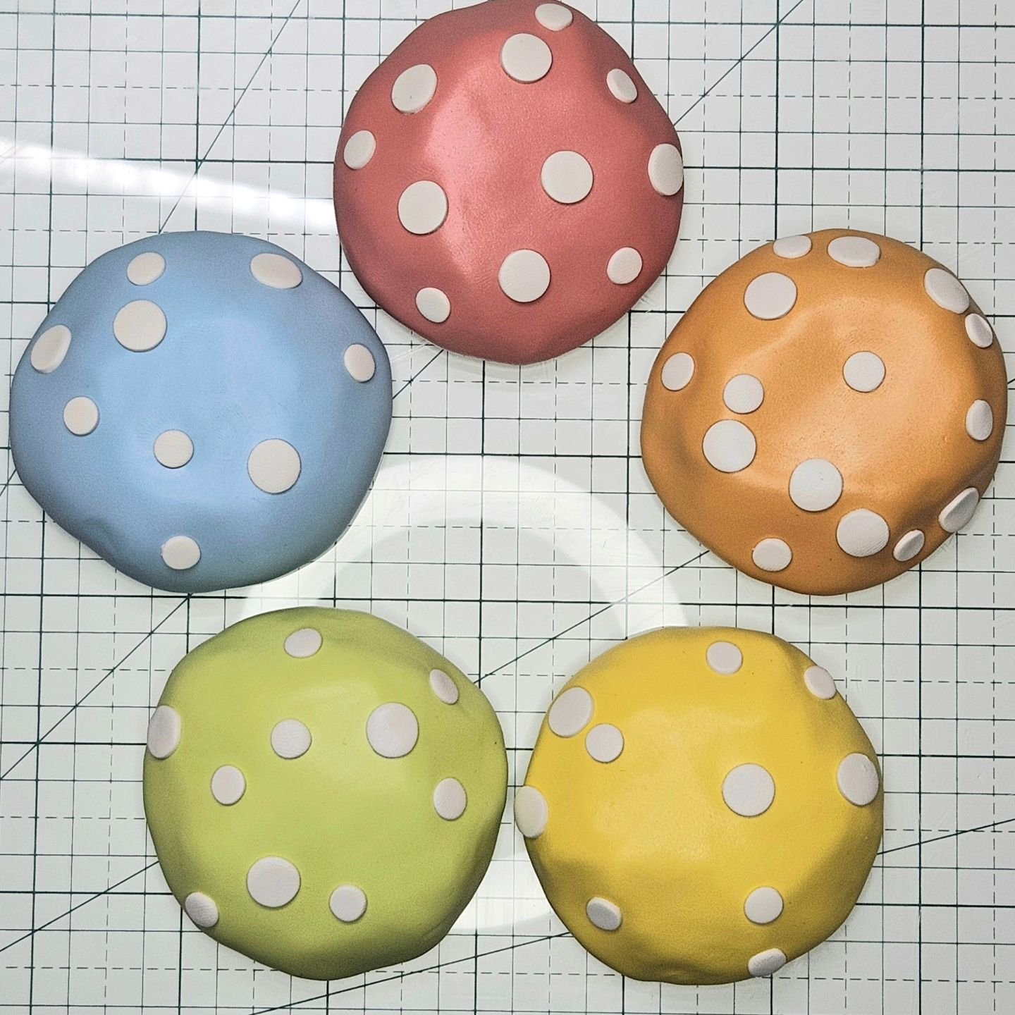 Currently on my desk...last batch of &quot;Whimsical Mushrooms &amp; Friends&quot; in the works. Hoping for a productive couple of days to get all these cuties complete ahead of schedule - all 100! 🤭😮

Love this current color palette btw...wonder w