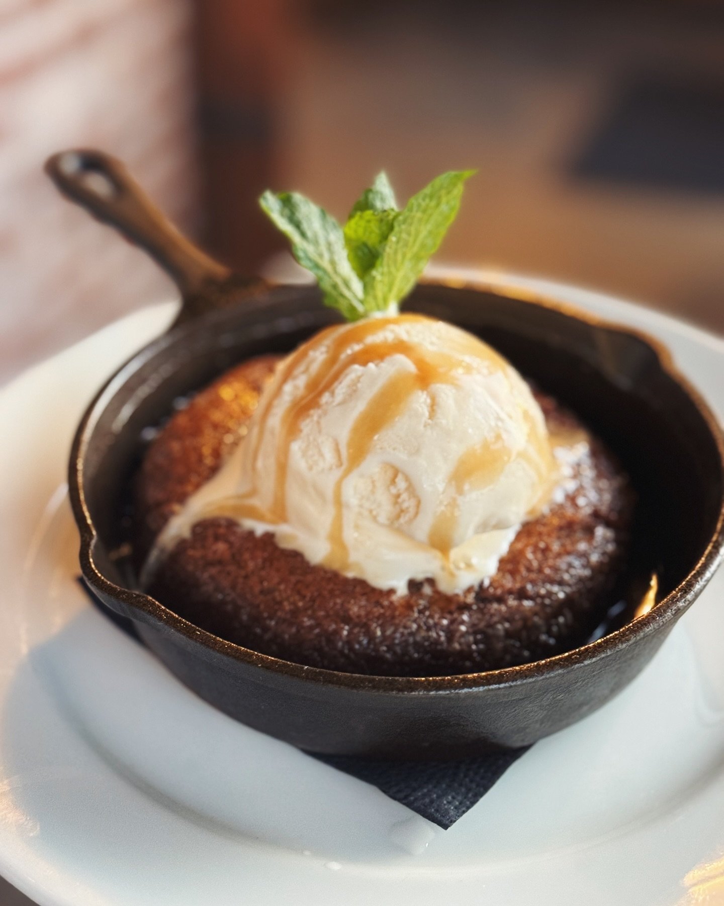 Our skillet cookie is pretty dang close to perfect. Warm chewy cookie, melty chocolate, bourbon caramel and vanilla ice cream to tie it all together. Available nightly ✨