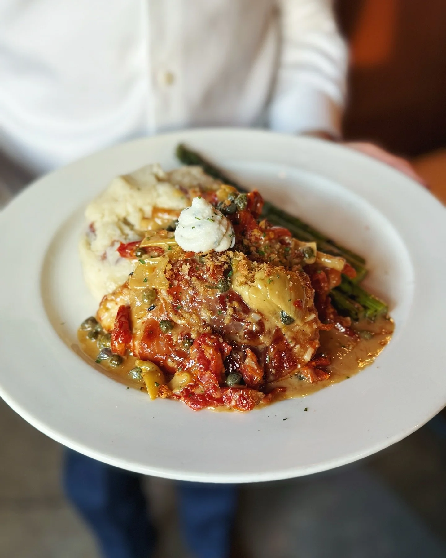 Prosciutto wrapped chicken breast with artichoke, capers, confit tomatoes, garlic and lemon herb ricotta - now available nightly ✨