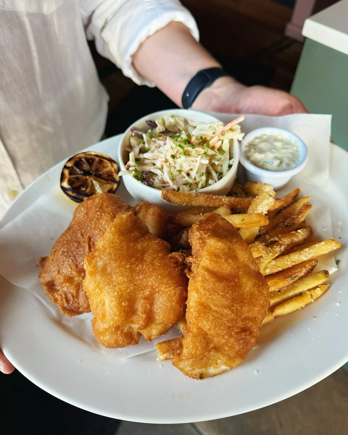 Thanks to Justin for modeling our newest entree: halibut fish and chips! 

Made with fresh Alaskan halibut and served with house peproncini tartar, rustic slaw and Parmesan fries. More new menu items to be announced shortly! ✨ 

Skillet cookie on us 
