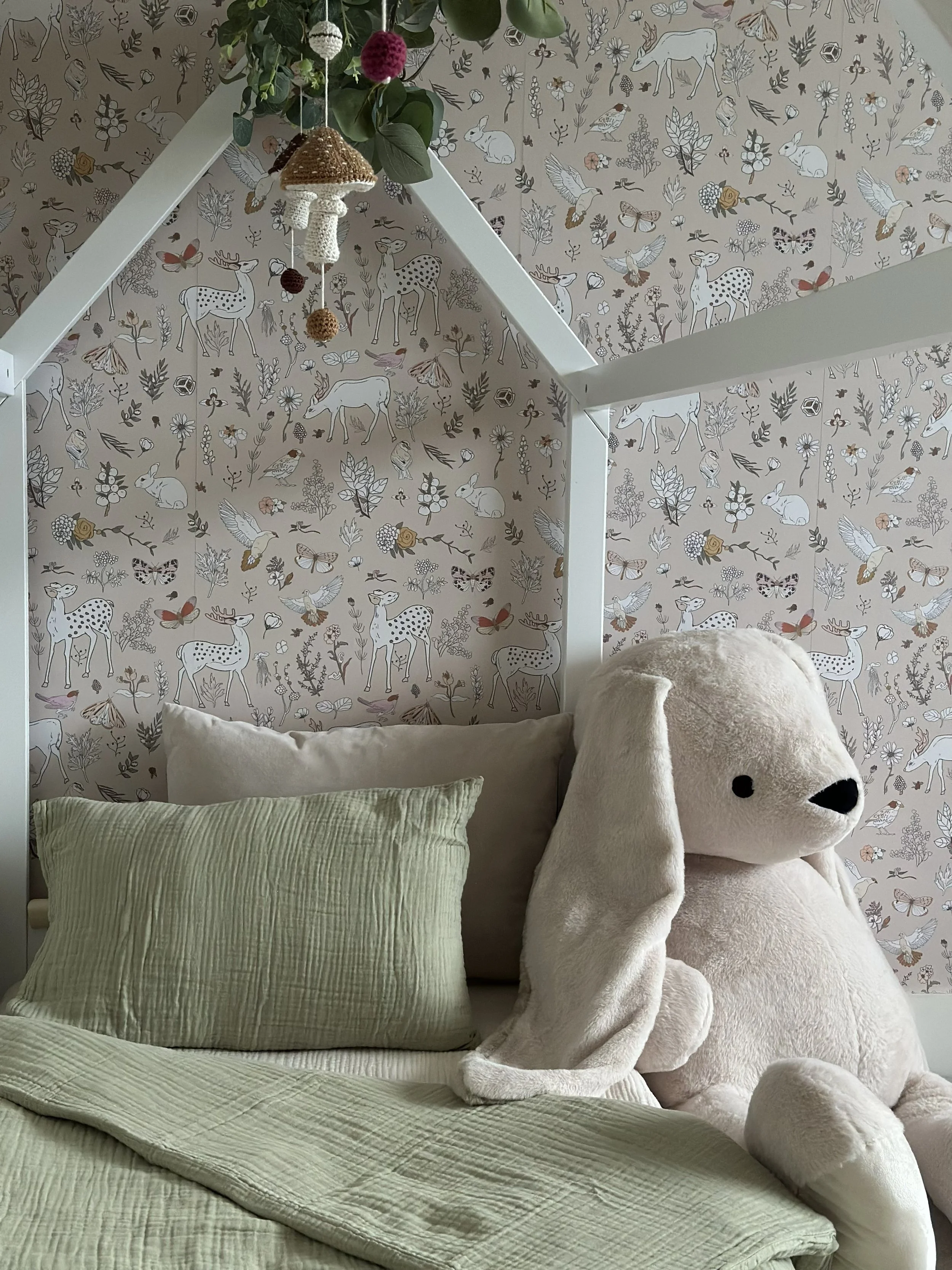 Soft nursery styling with plush toys, natural fabrics and gentle colours creating a warm and comforting baby room.