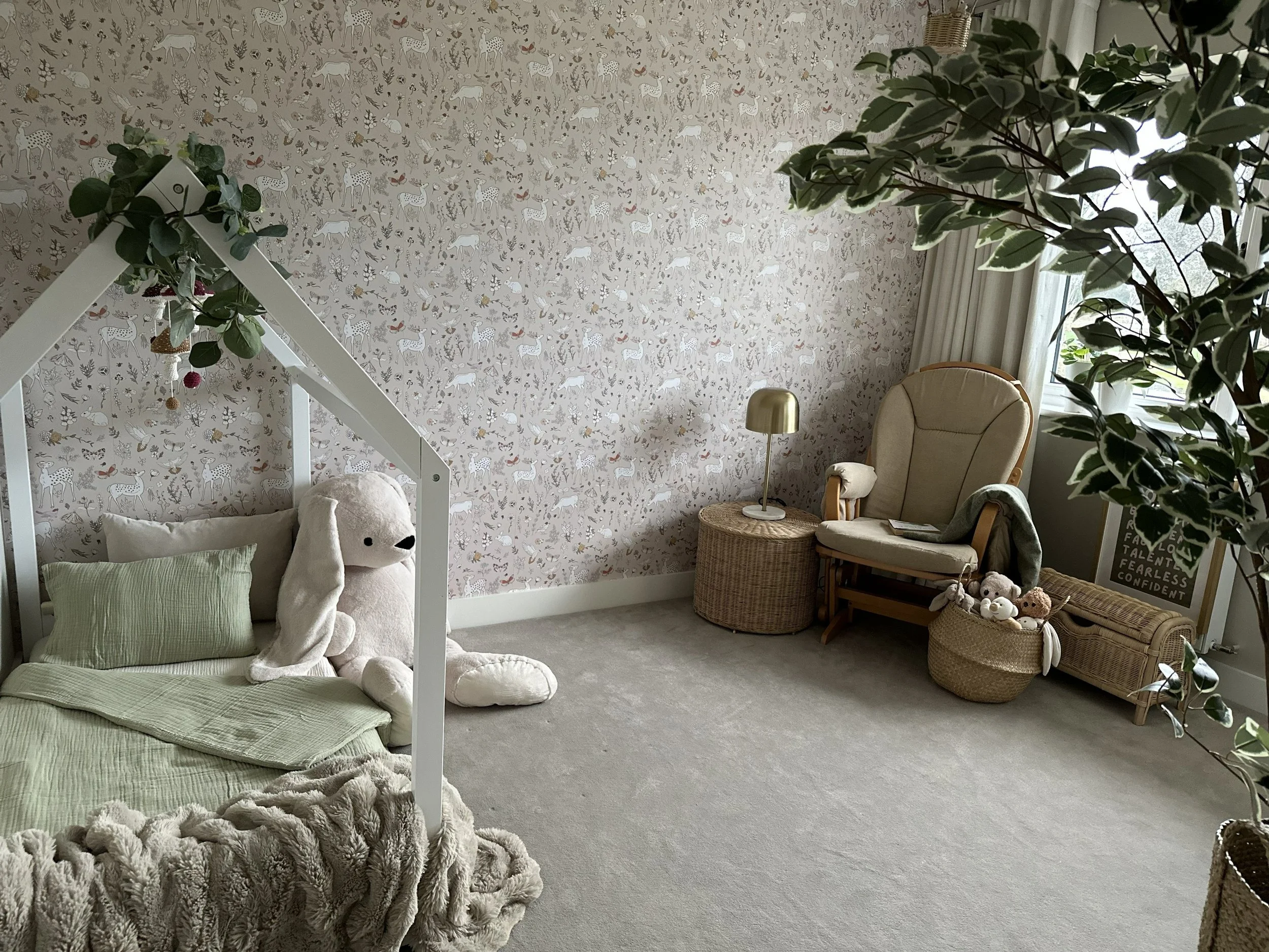 Soft neutral nursery designed to create a calm and nurturing environment for early childhood. Natural textures, soft greens and warm lighting bring a sense of comfort and wellbeing.