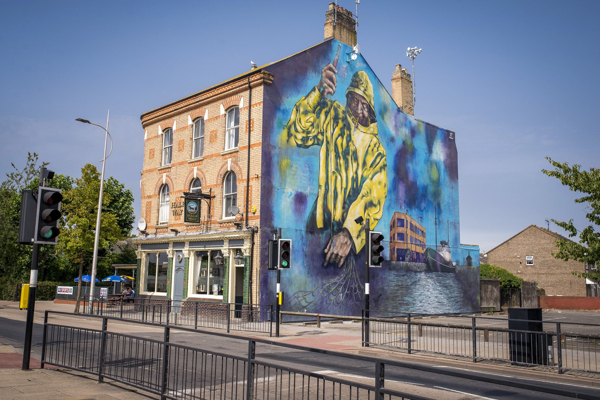 One of the traditional trawlermen's pubs the Halfway pub. As a tribute to Hull's fishing history, local artists Andy Pea, Sharon Darley and Lydia Caprani teamed up with Belfast artists Mark Ervine and Kev Largey to create a mural depicting life of tr
