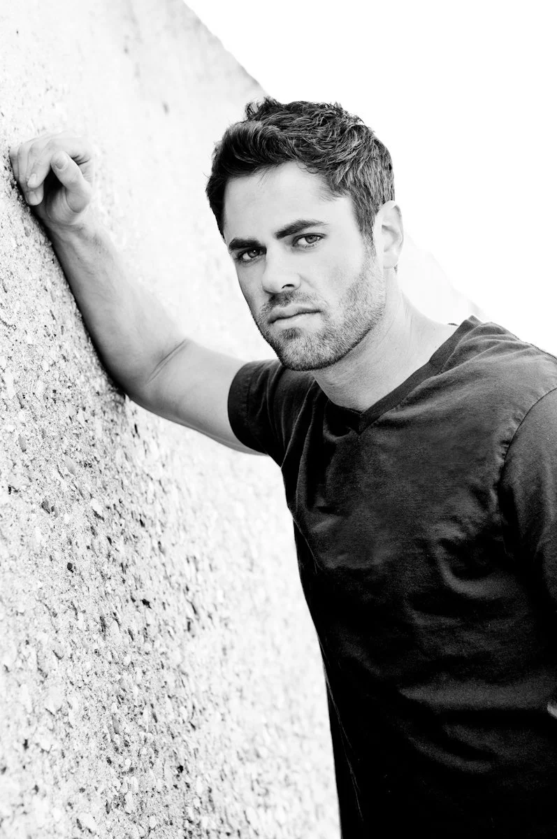 Attractive Male Posed on Wall