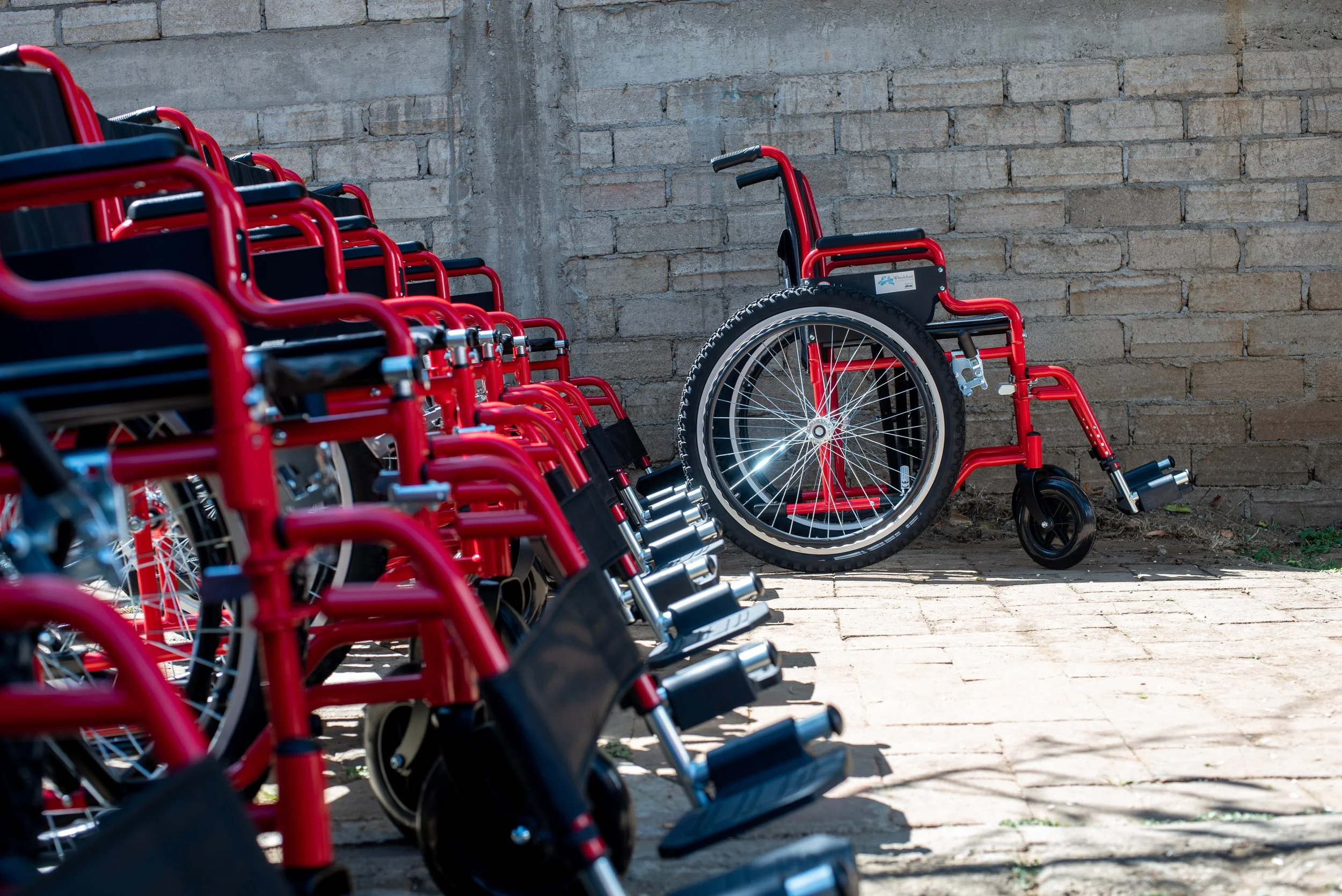 a row of red wheel chairs
