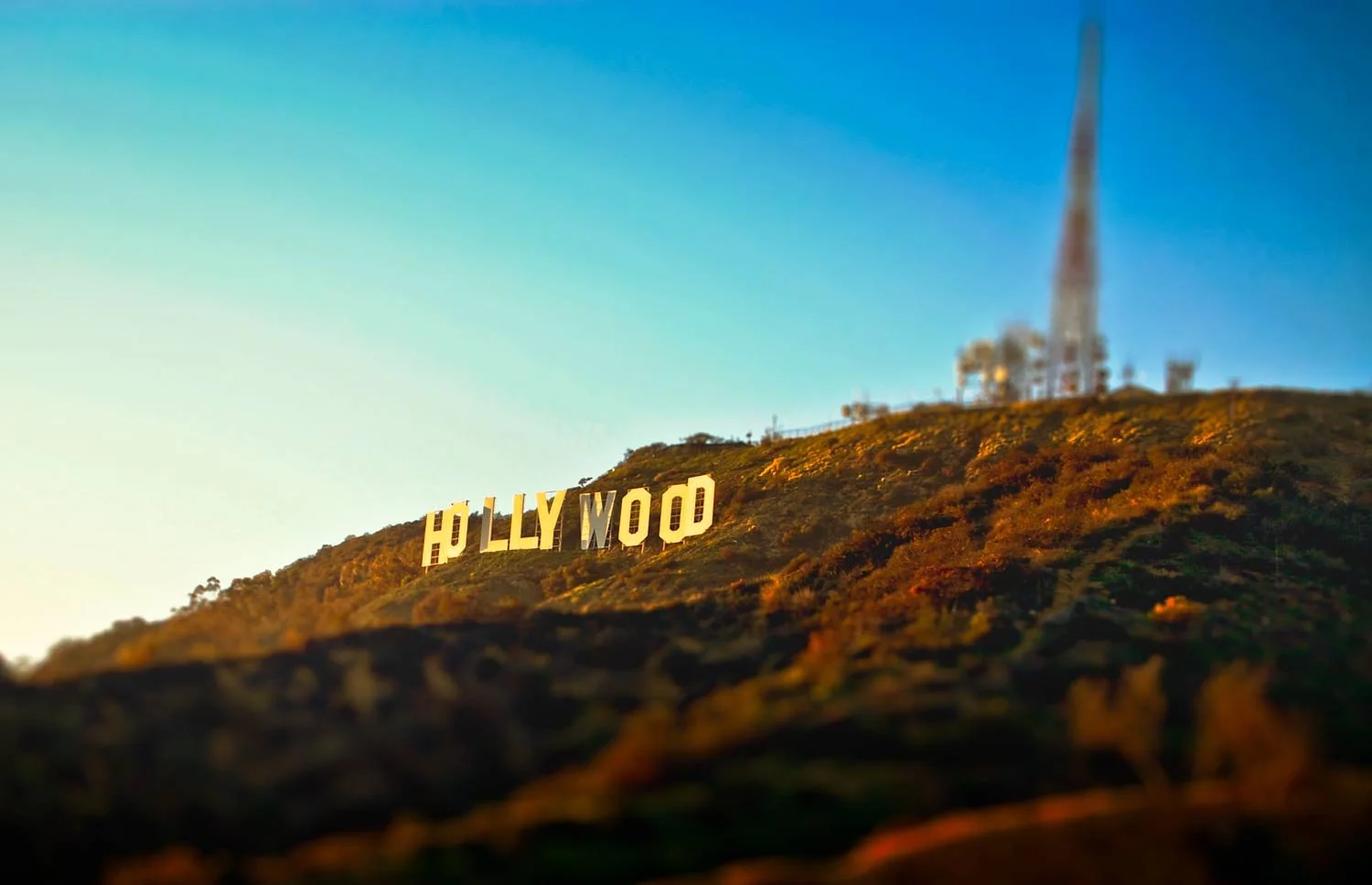 Hollywood sign on a hillside with a clear sky background.