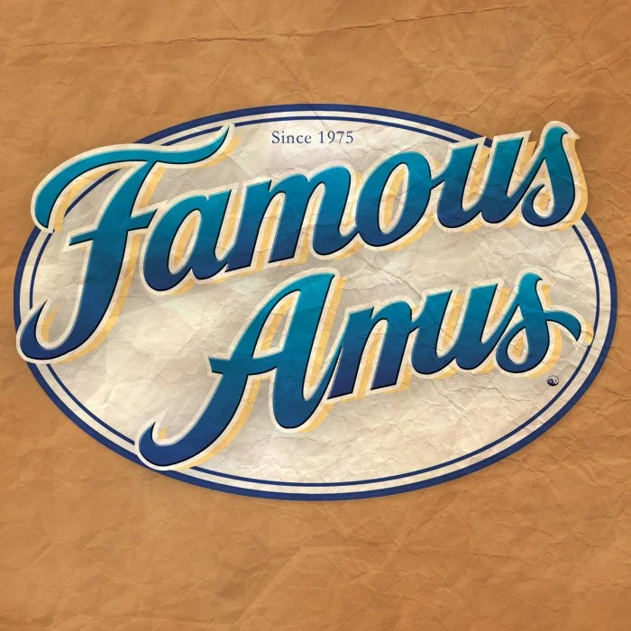 Sign that reads 'Famous Anus' with the text 'Since 1975' above, on a crumpled paper background.