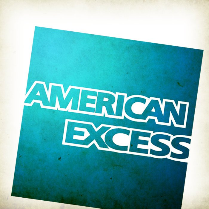 Book titled 'American Excess' with a blue cover, rotated at an angle.