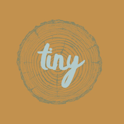 A graphic of a tree ring cross-section with the word "tiny" written across it in light blue letters.