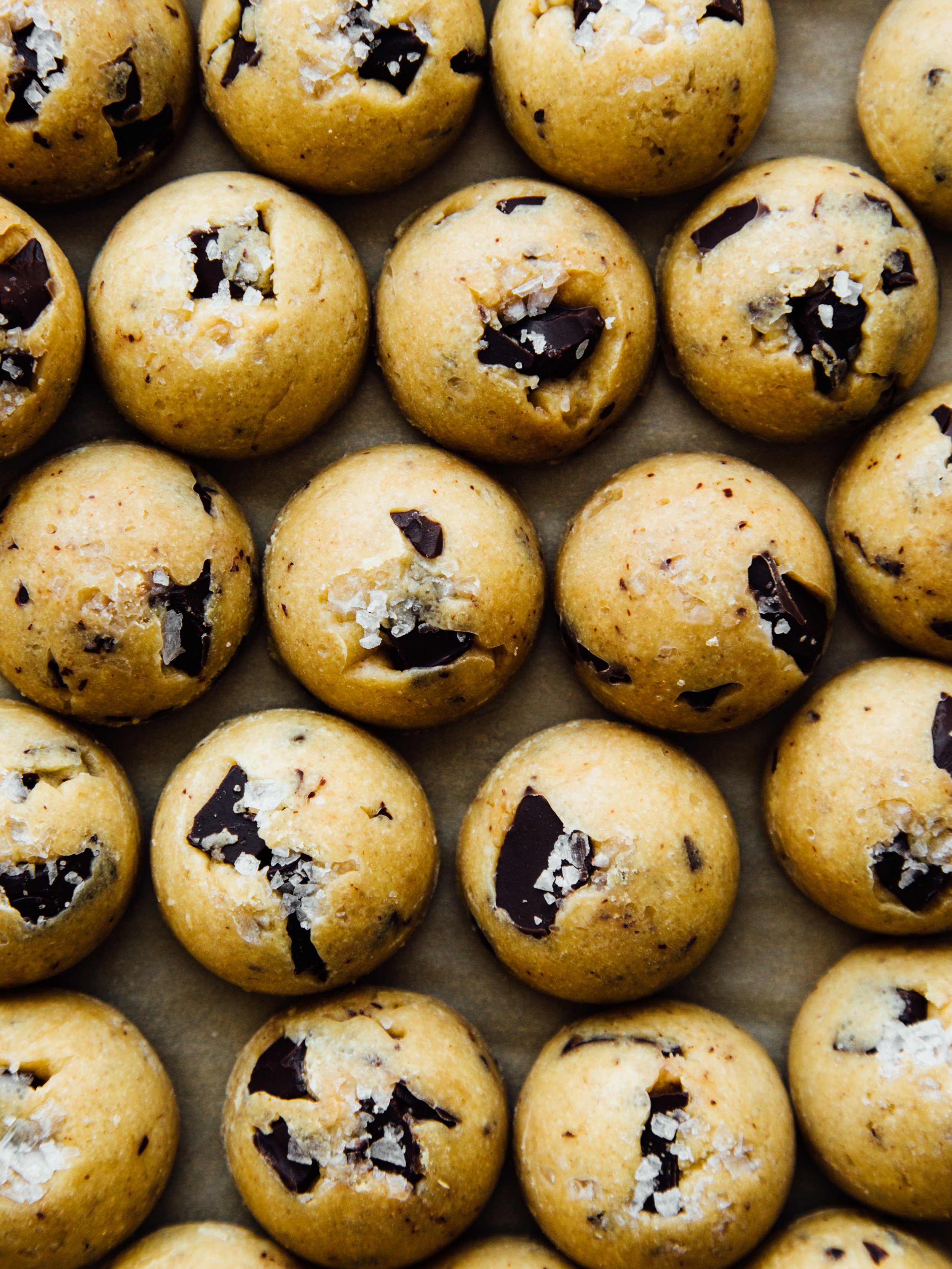 Close-up of rows of chocolate chip cookies with sea salt