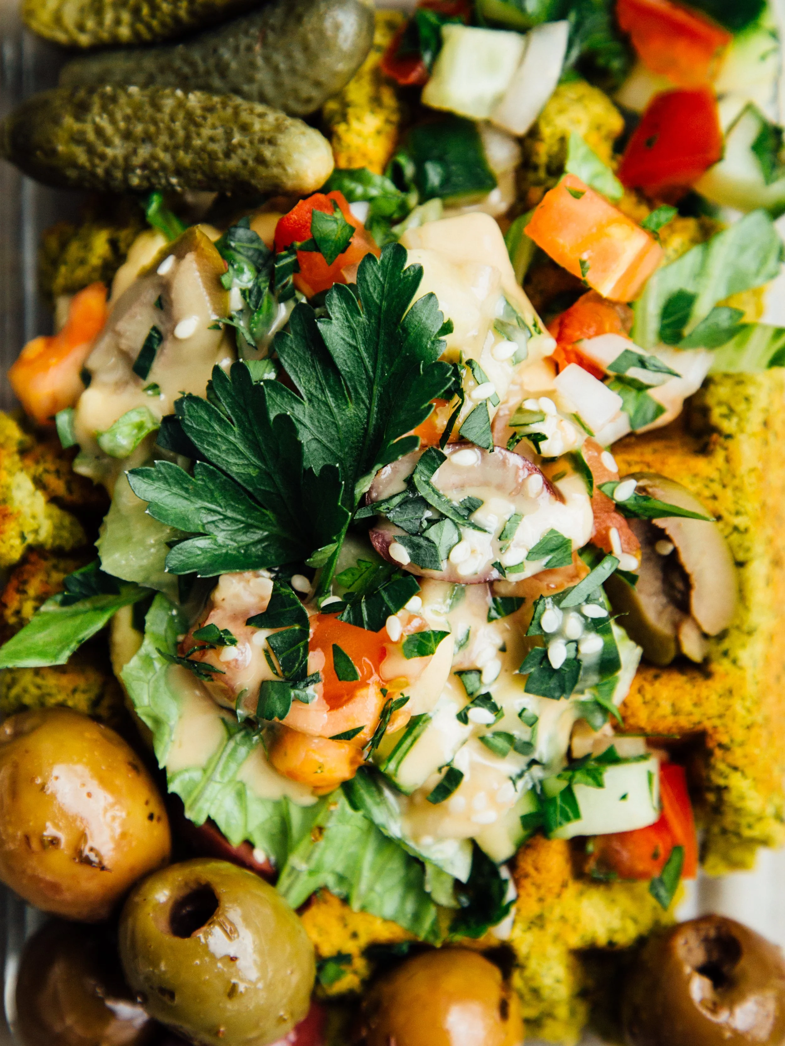 Colorful Greek salad with vegetables, olives, herbs, and feta cheese