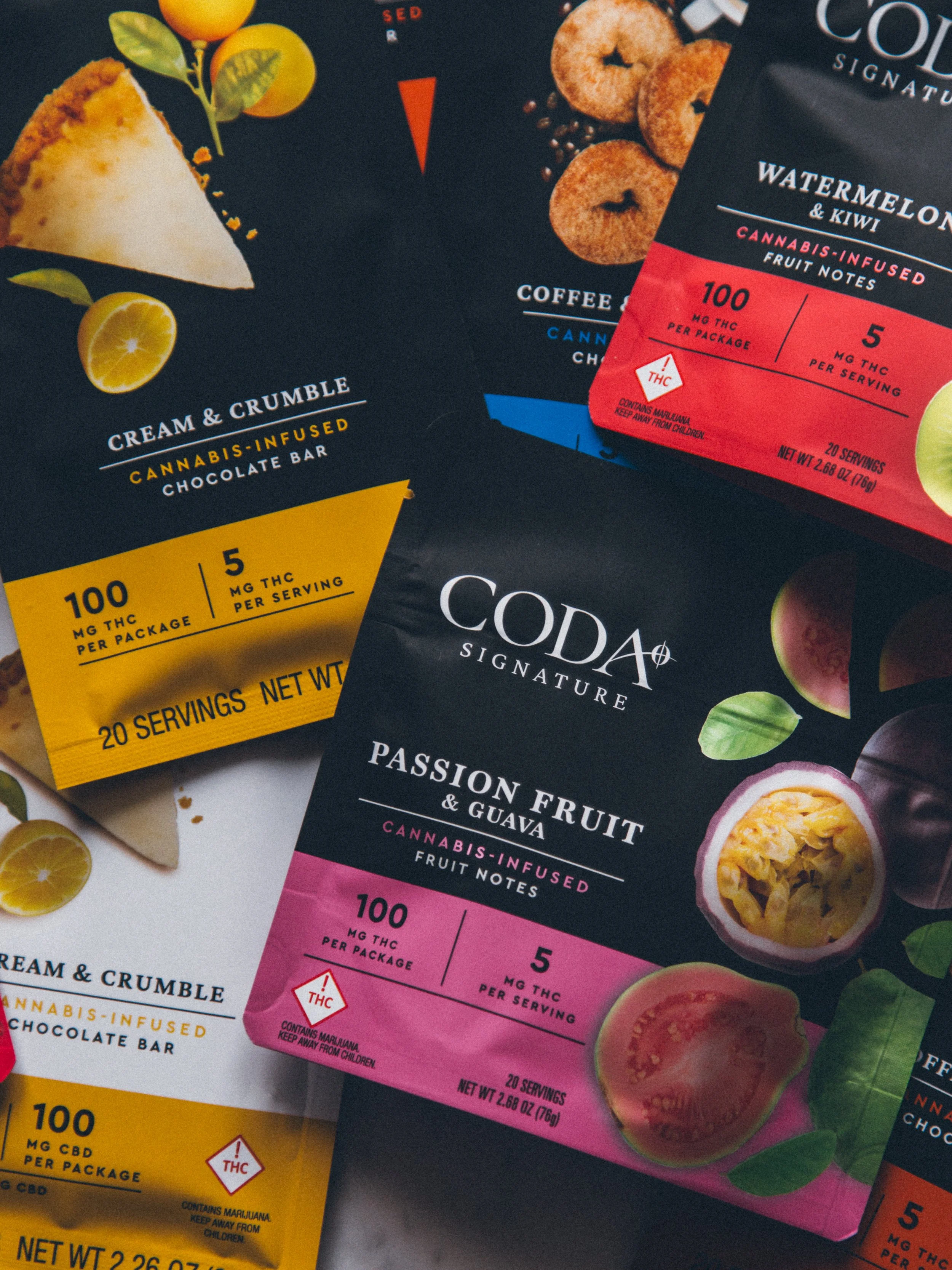 Packaging of cannabis-infused products including a chocolate bar, watermelon and kiwi fruit notes, and passion fruit with guava fruit notes, all with labels indicating THC content and serving sizes.