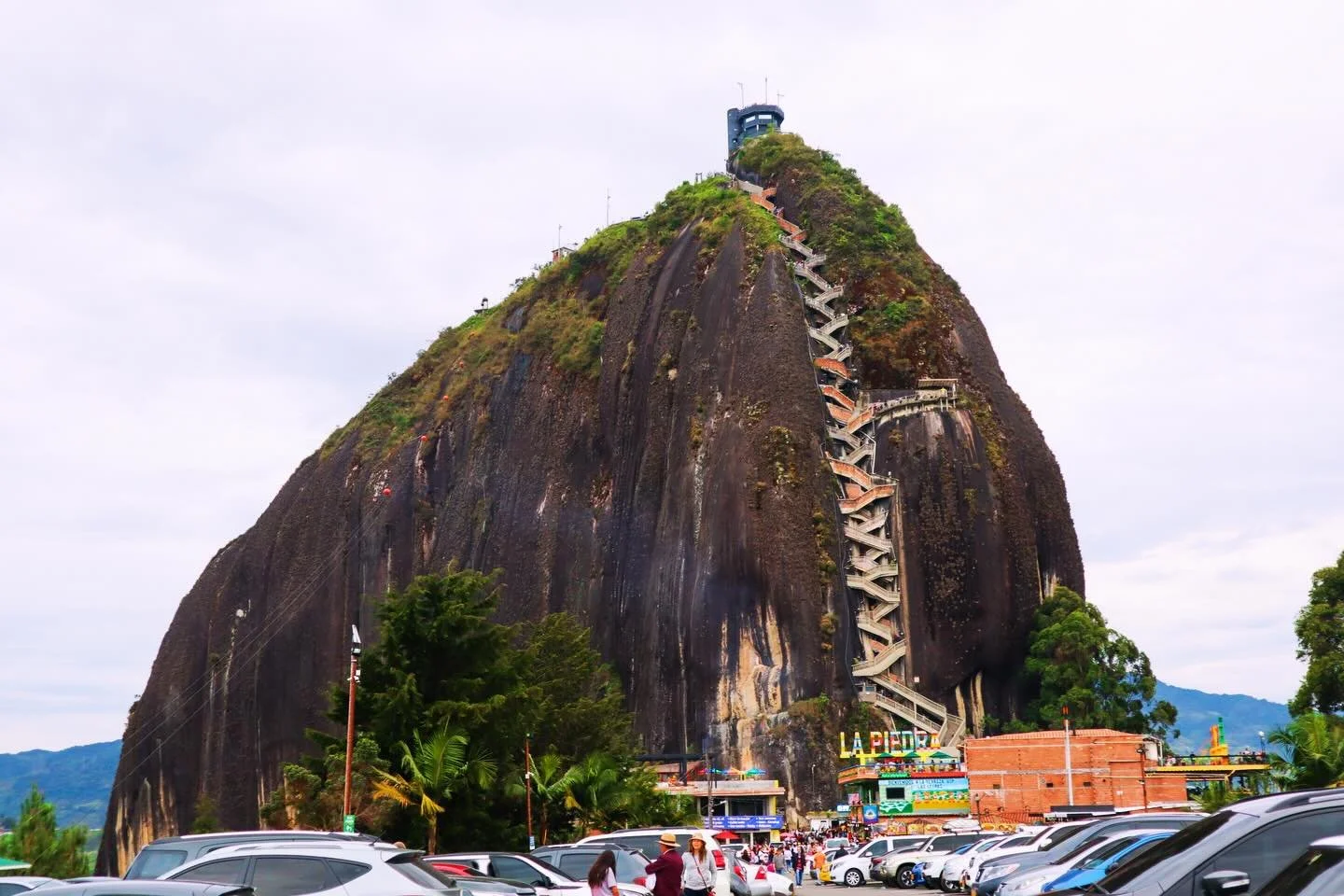 You&rsquo;re about to climb 740 steps and question all your life choices halfway up! The view from the top in the last slide? Earned. 
.
.
El Pe&ntilde;&oacute;n de Guatap&eacute; (Guatape&rsquo;s rock), located in Medellin, is actually a single ston