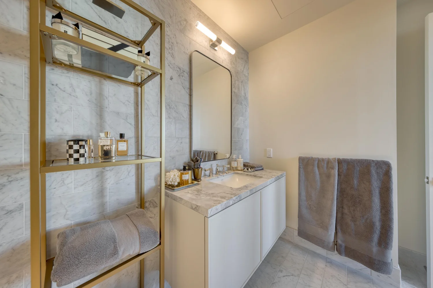 1515 Union St #5C — guest powder room with brass shelving