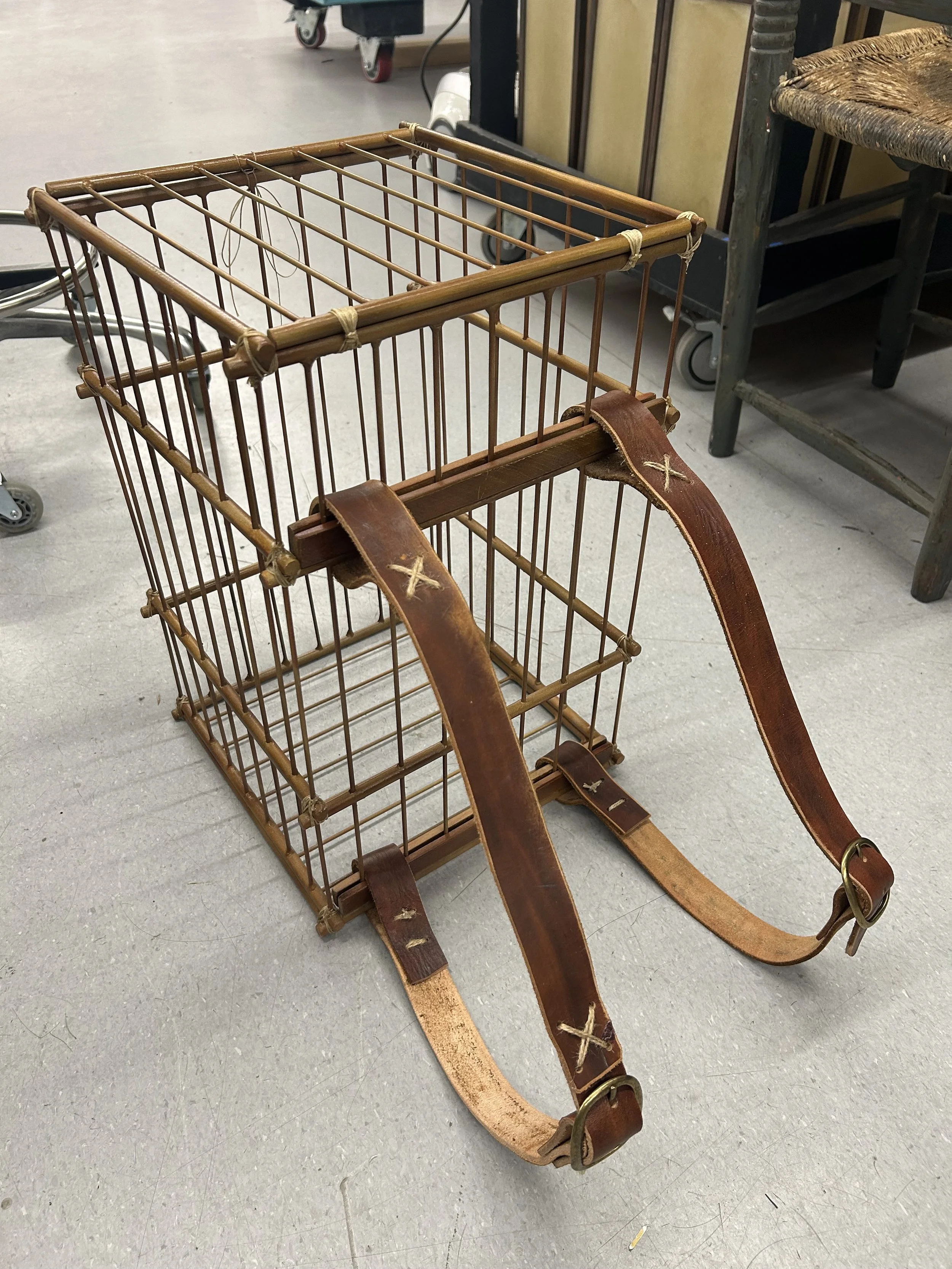birdcage backpack (welding rods, dowels, wood, spray paint, leather, twine)