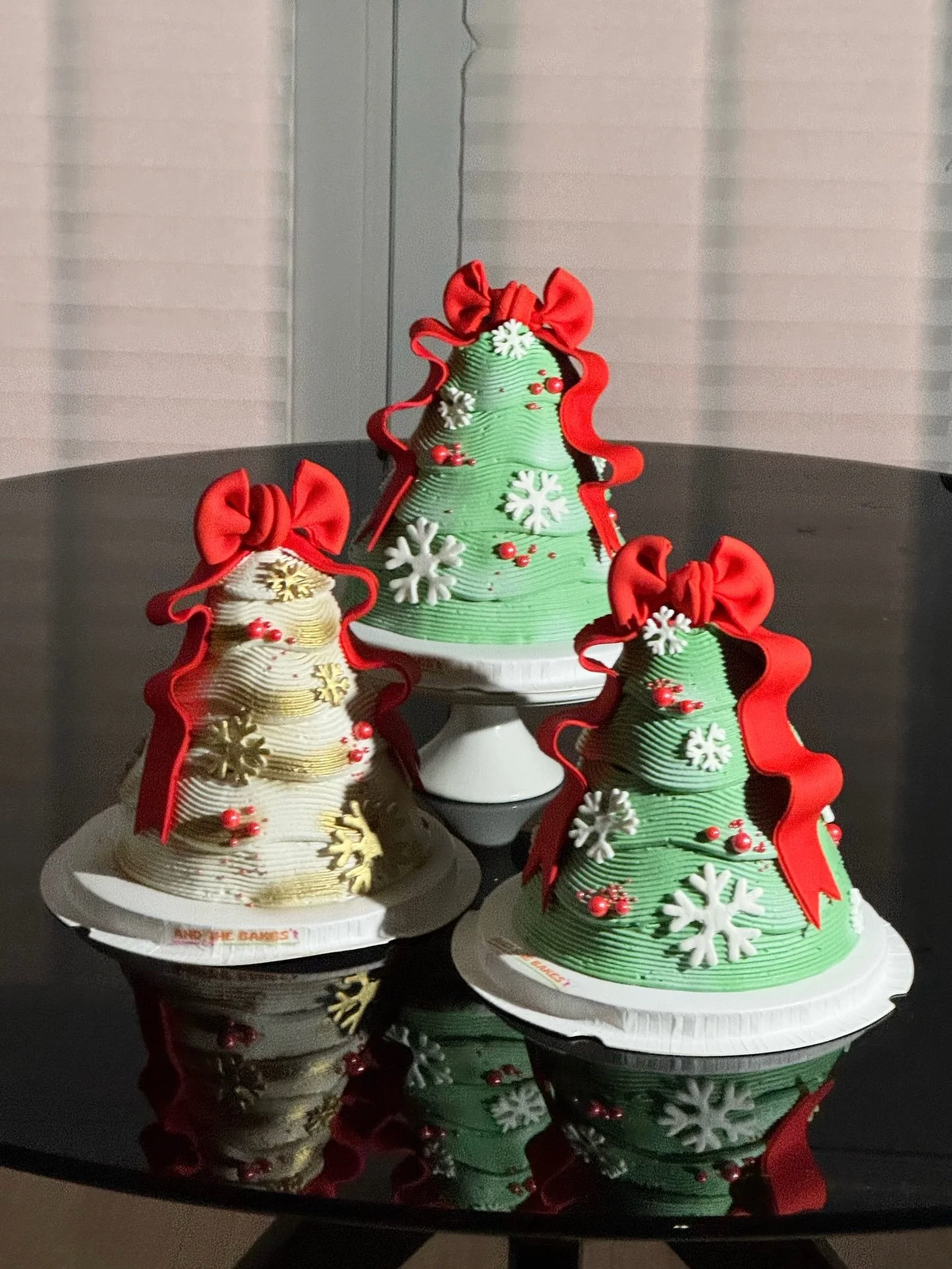 The Christmas Tree Cake. Available in green &amp; white. Moist chocolate cake filled with rich hot chocolate ganache. Many available dates for pick up &amp; delivery all the way up until Christmas Eve. Pre-order yours now using the link in my bio🎄🎂