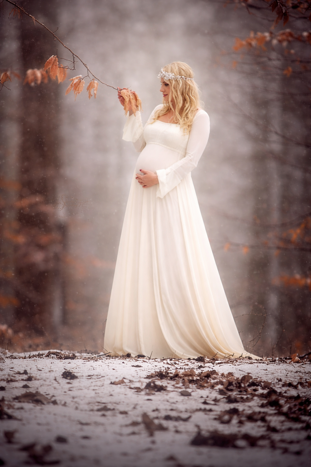 A quiet, intimate maternity portrait celebrating the beauty of motherhood-soft light, flowing fabric, and a moment of calm connection before everything changes.