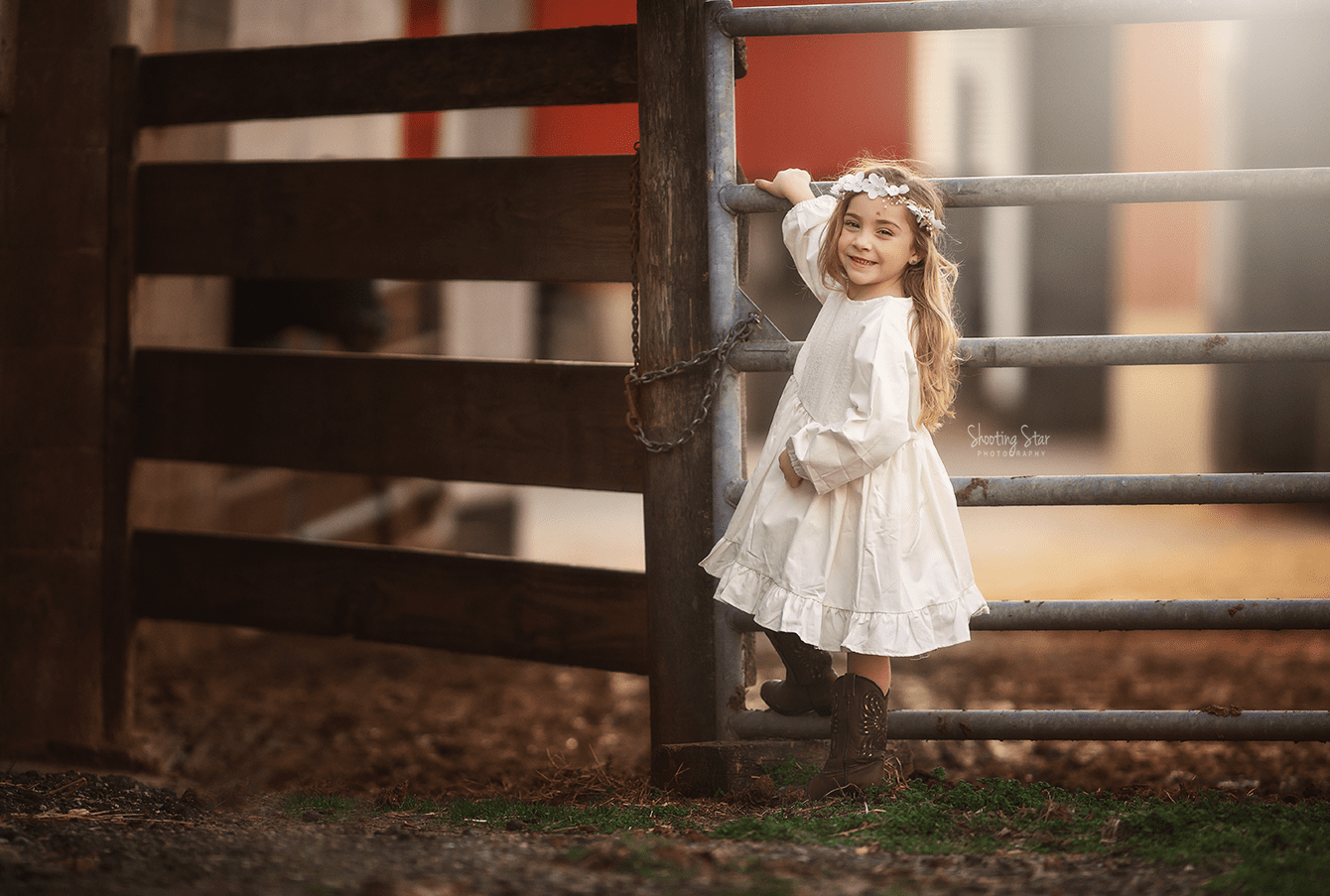 A young girl wearing a white vintage-inspired dress, photographed in soft natural light for a timeless fine art portrait that evokes classic styling and quiet countryside charm in South Jersey.