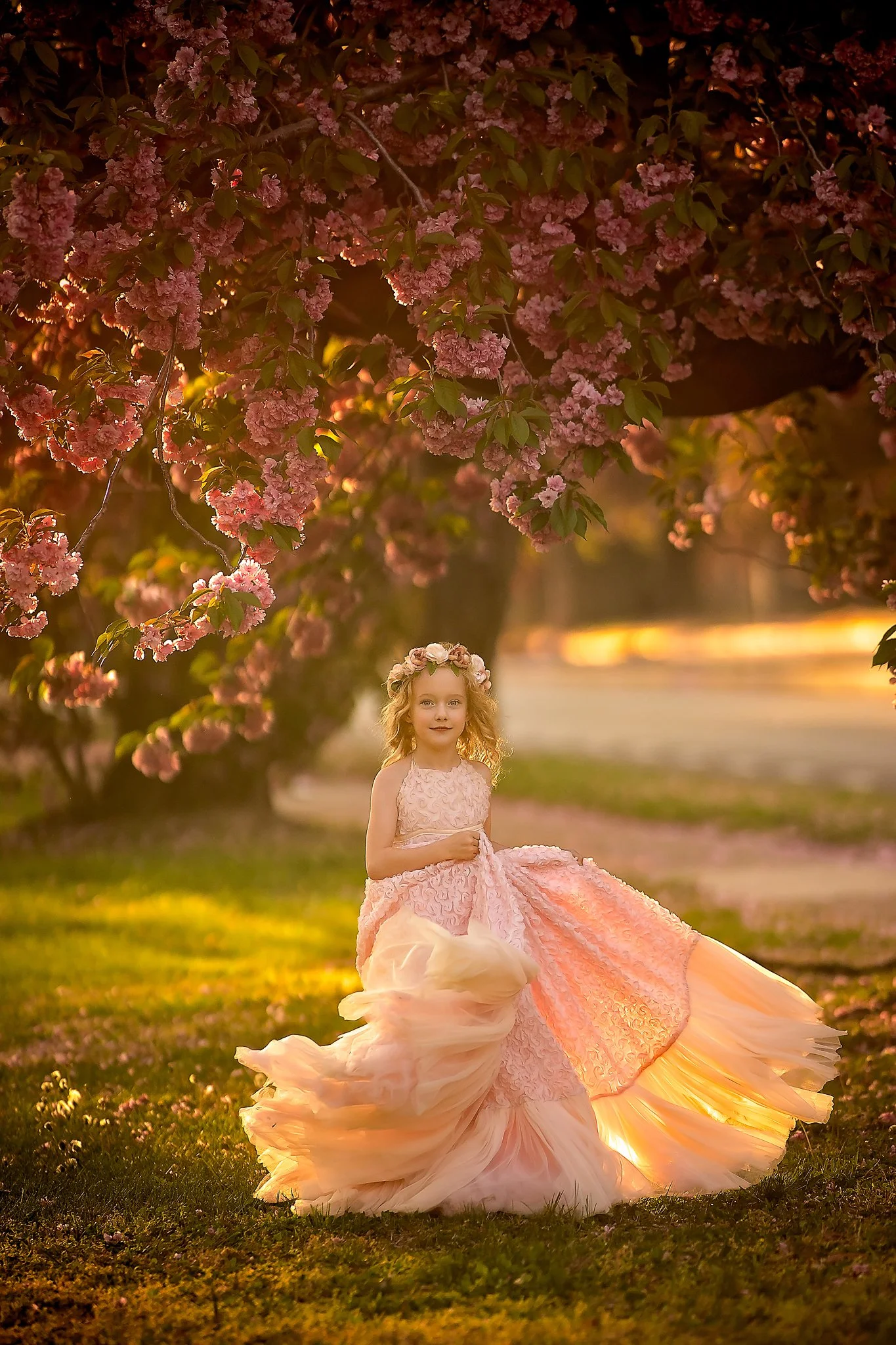 Portrait of a young girl twirling in a dress during a golden hour family photography session in Cherry Hill, New Jersey.