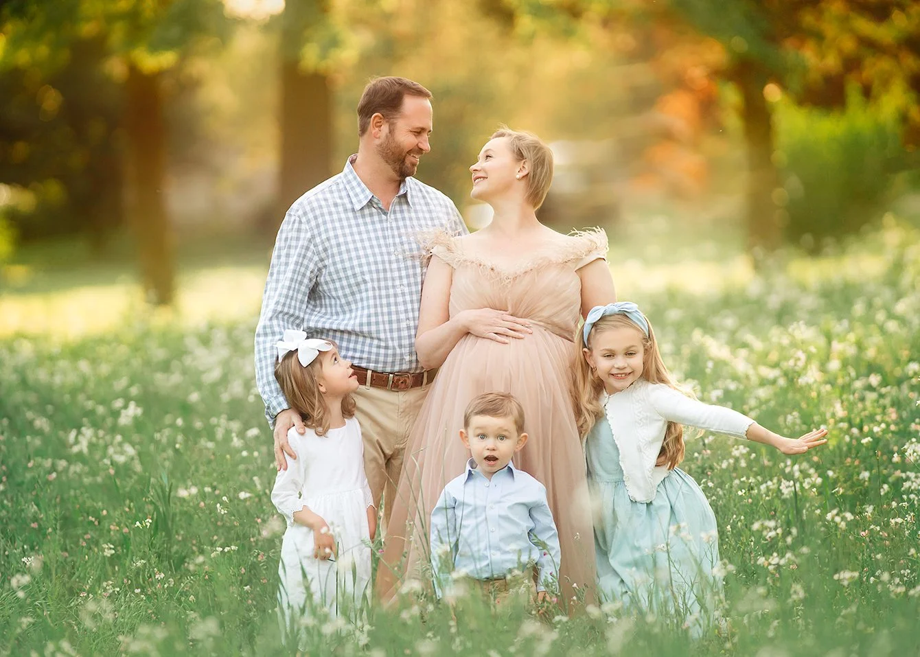 Family portrait session in a wildflower meadow at sunset in South Jersey.